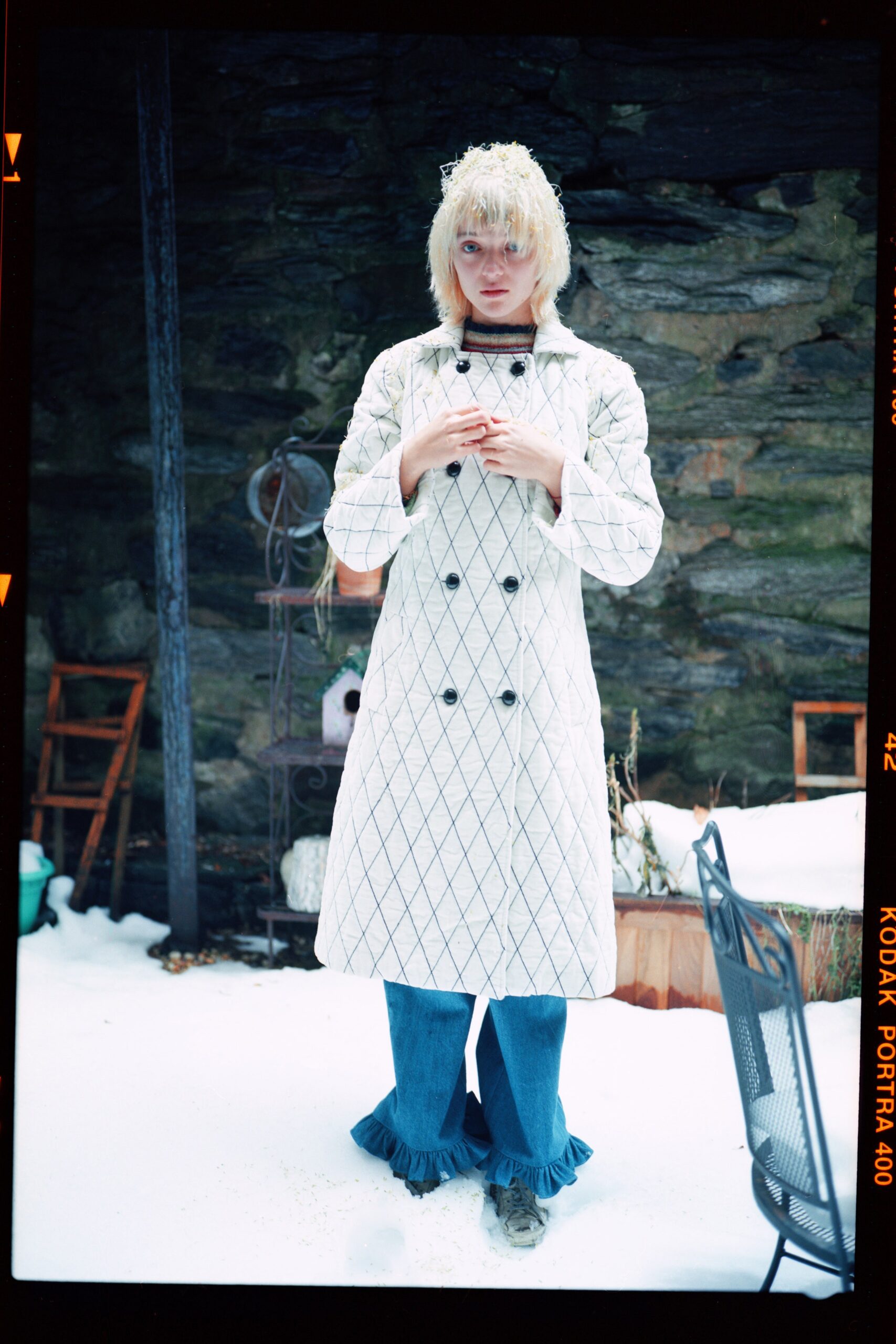 white quilted coat with blue pants