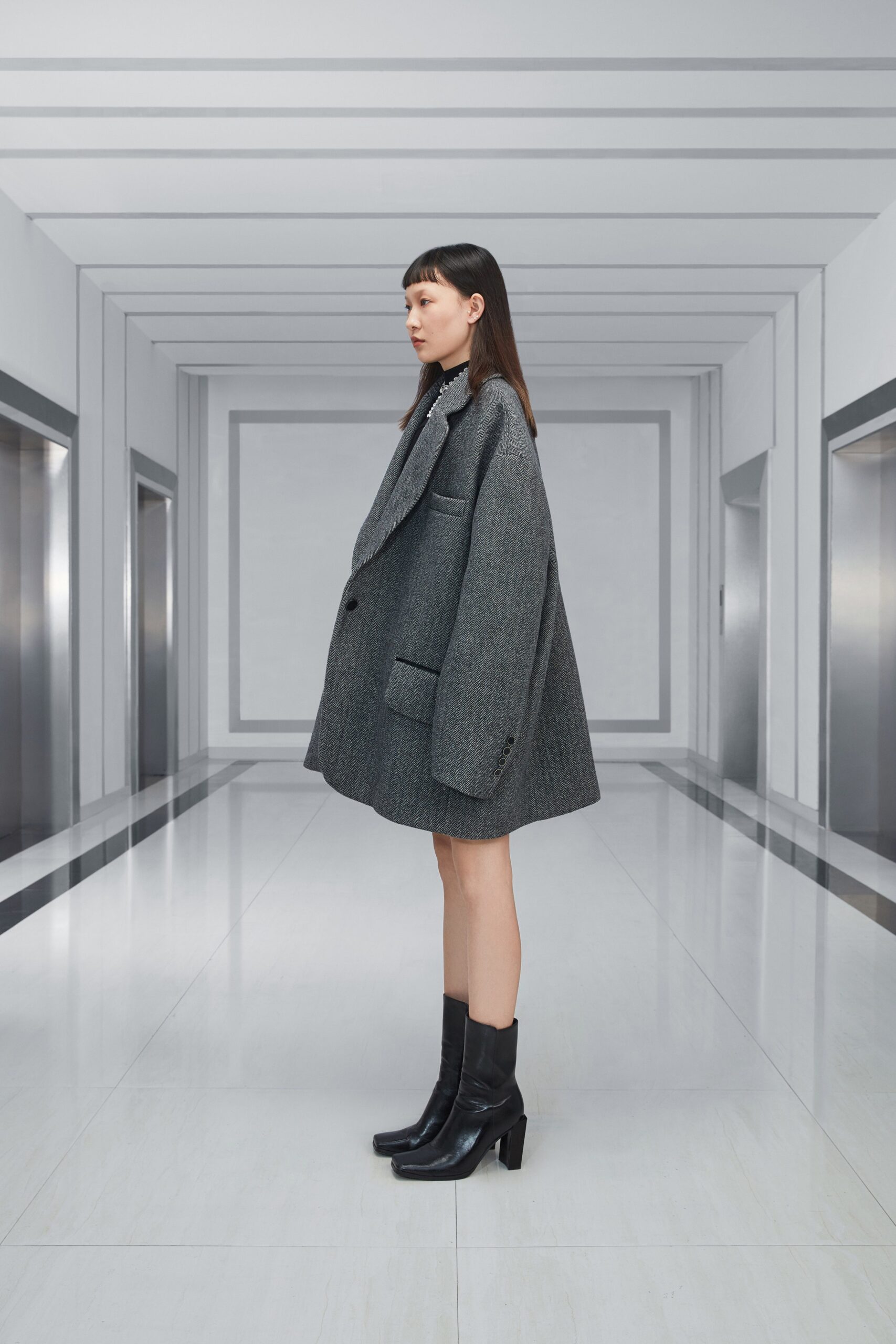 gray oversized wool coat and black boots