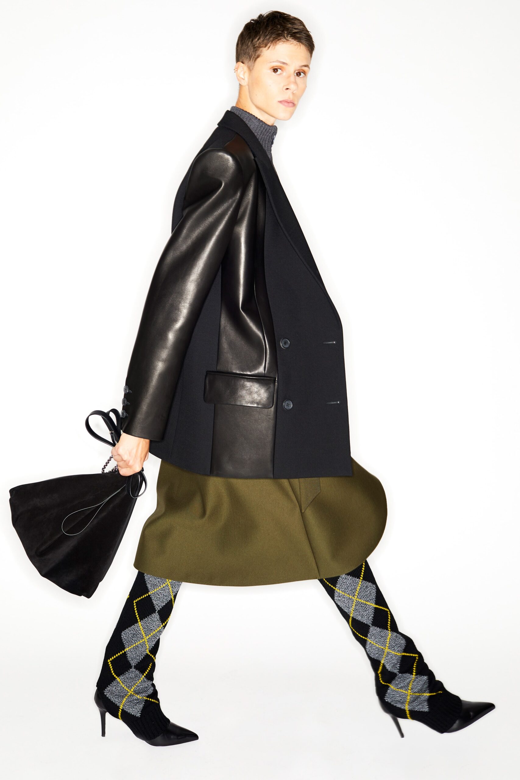 black tailored blazer with green skirt