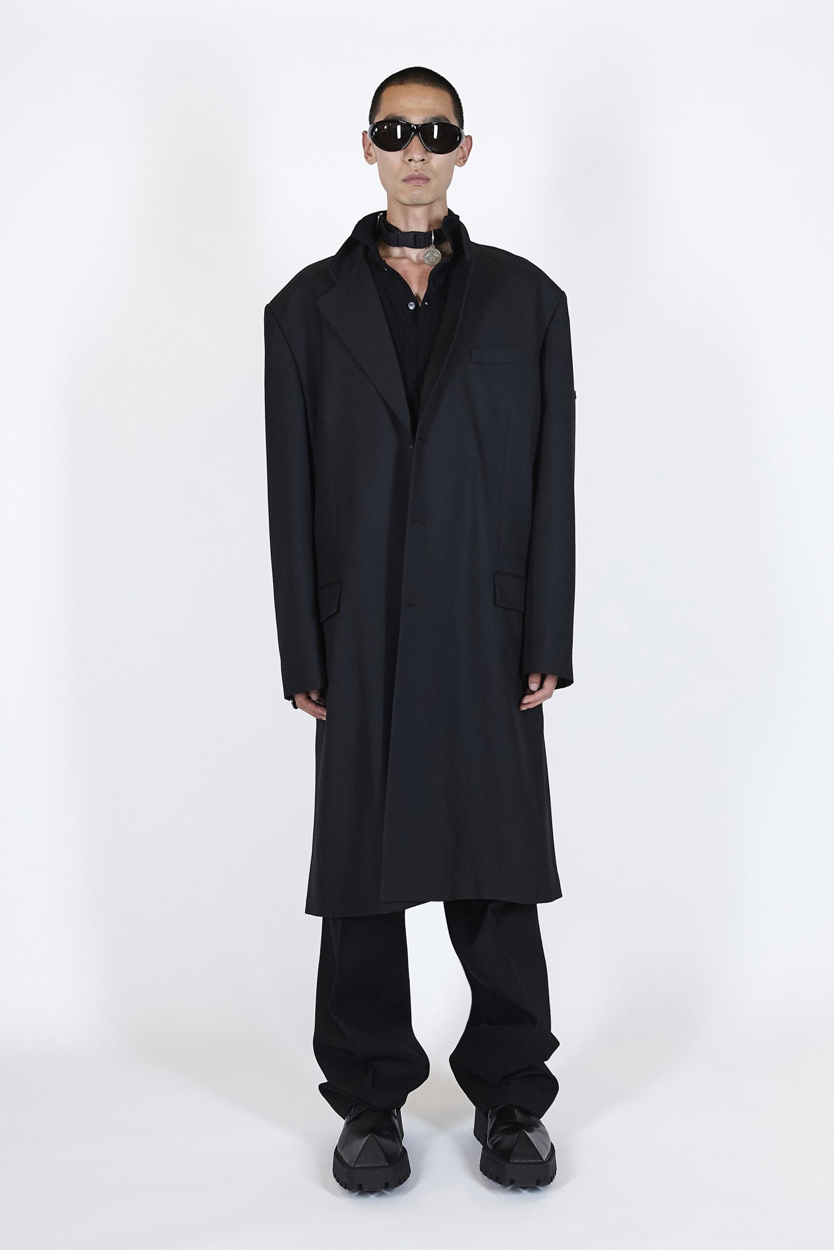 black wool long-sleeve collared oversized buttoned coat