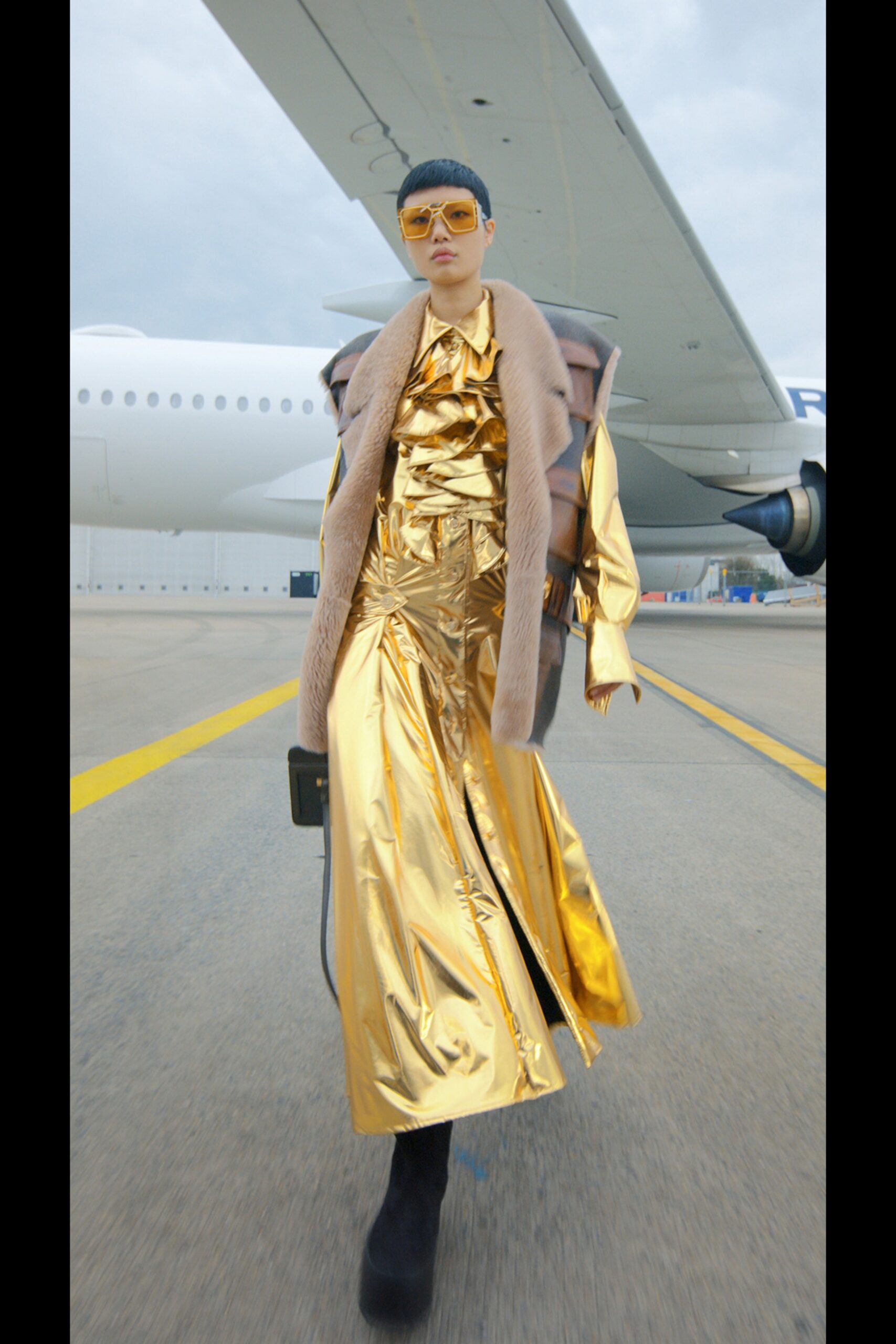 gold vinyl sleeveless v-neck fitted draped shiny gown