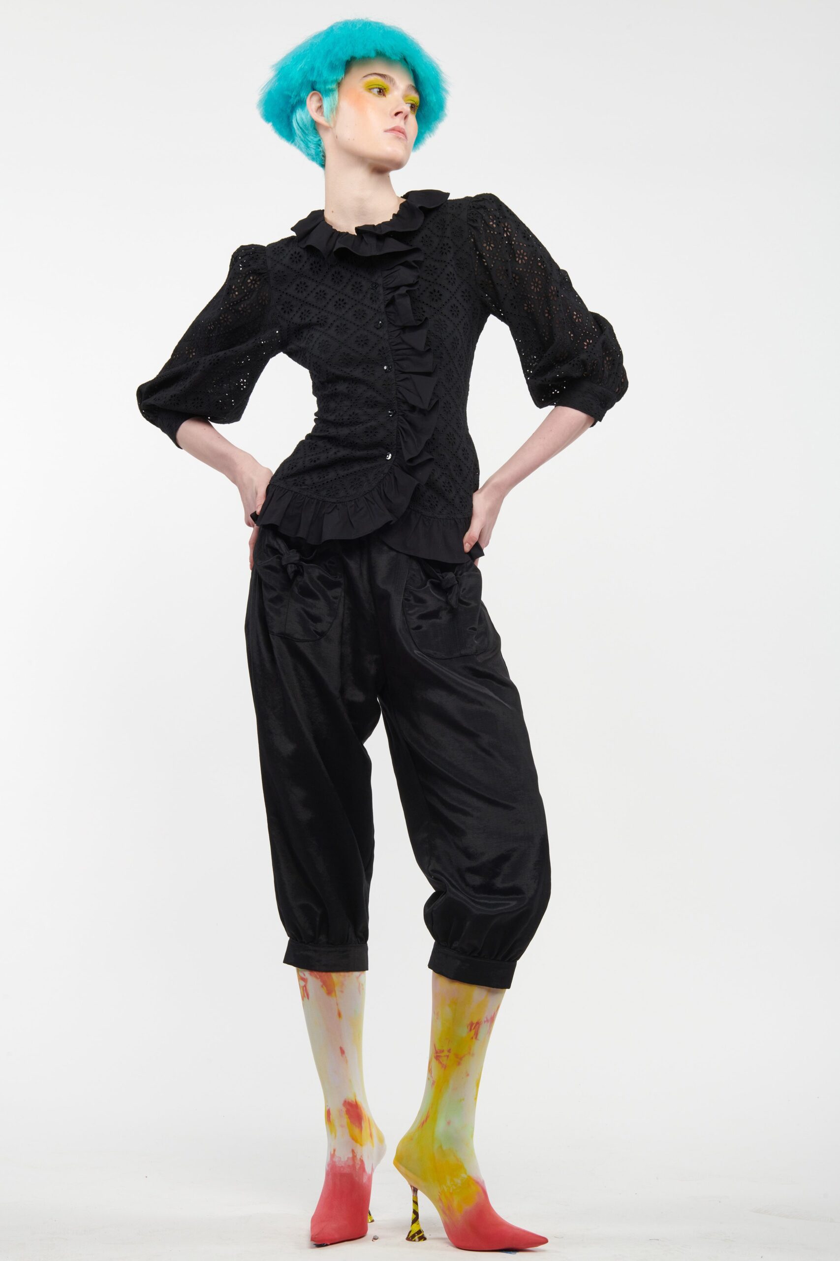 black fitted blouse and relaxed pants
