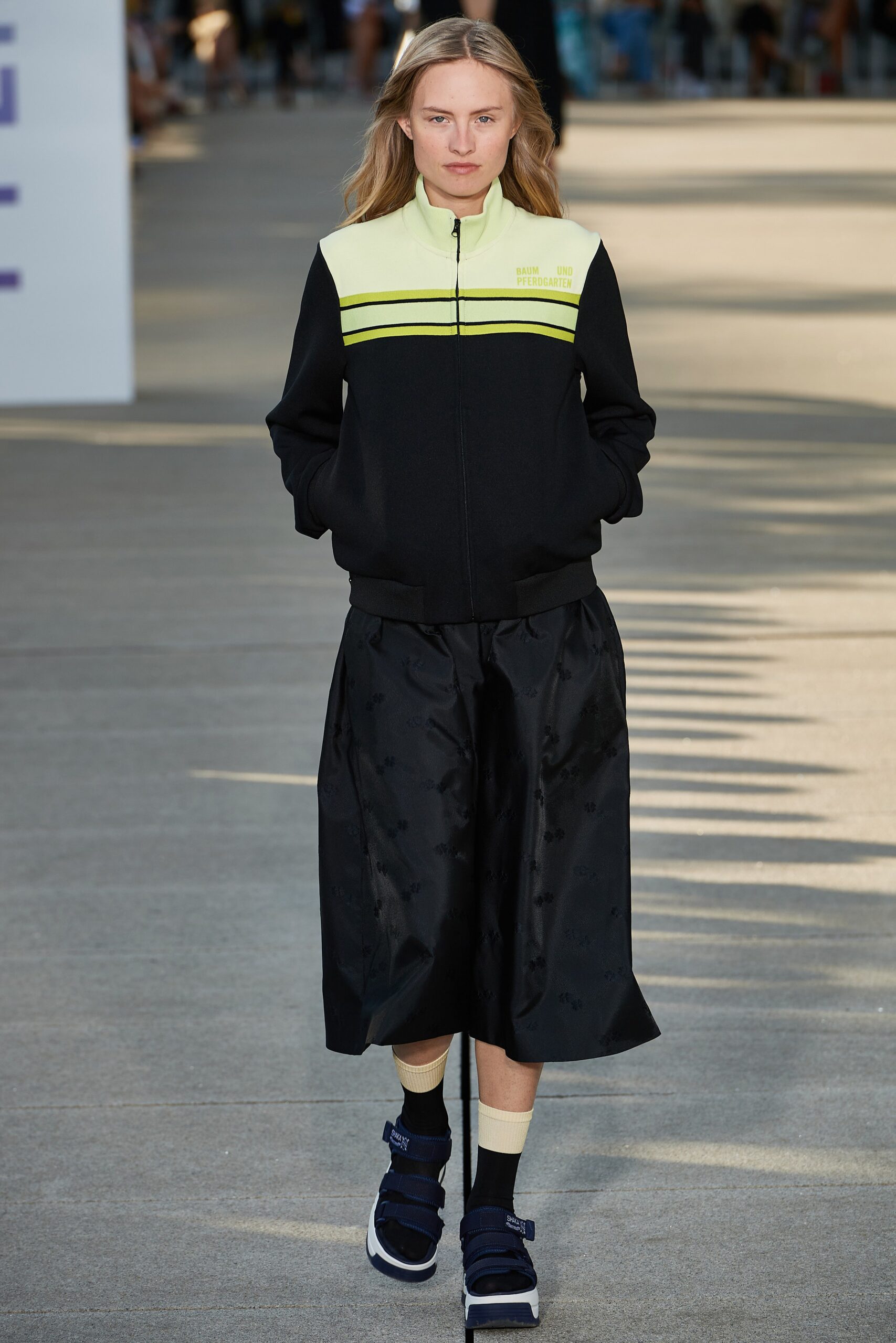 black and yellow fitted jacket with midi skirt