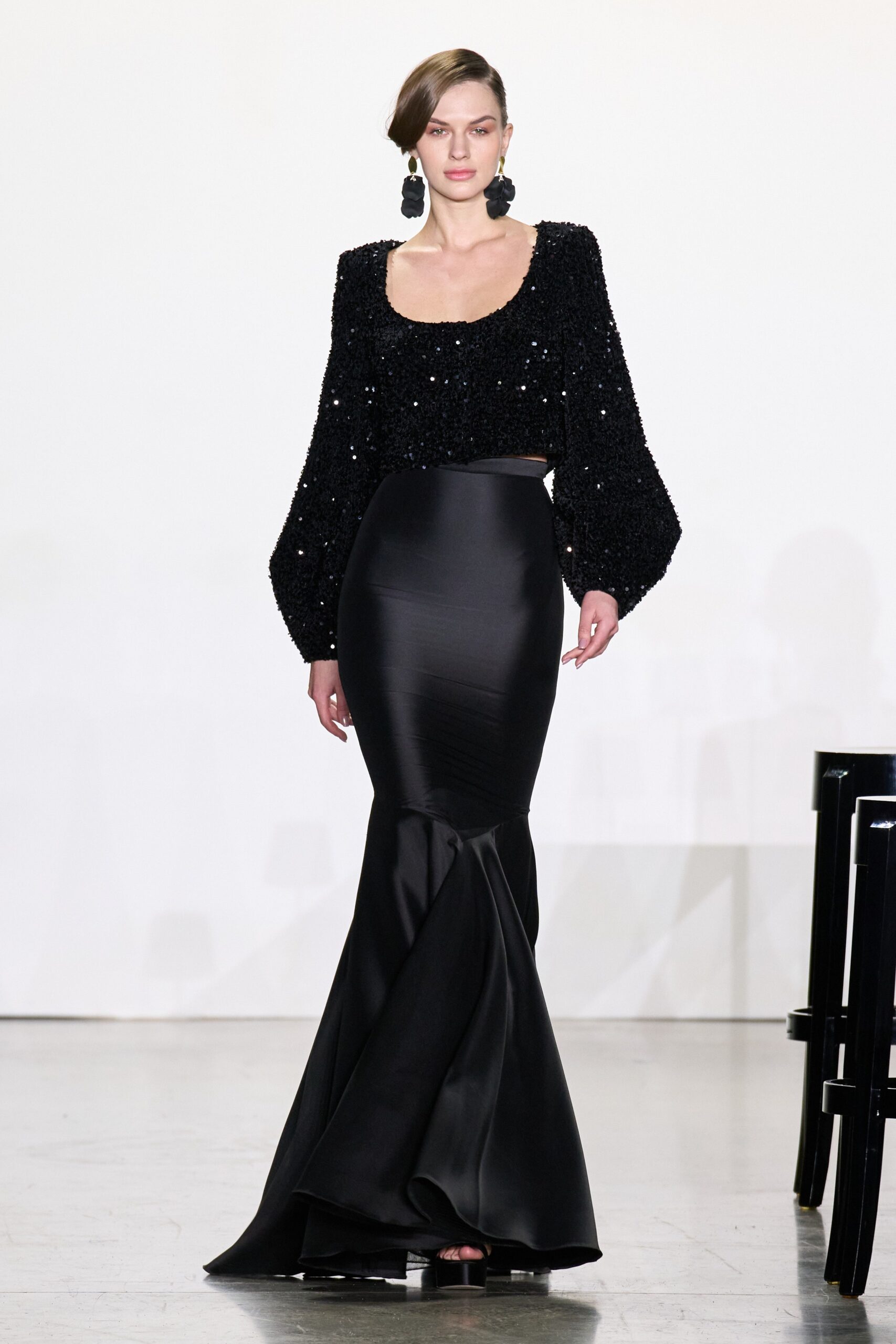 black sequined top and flared skirt