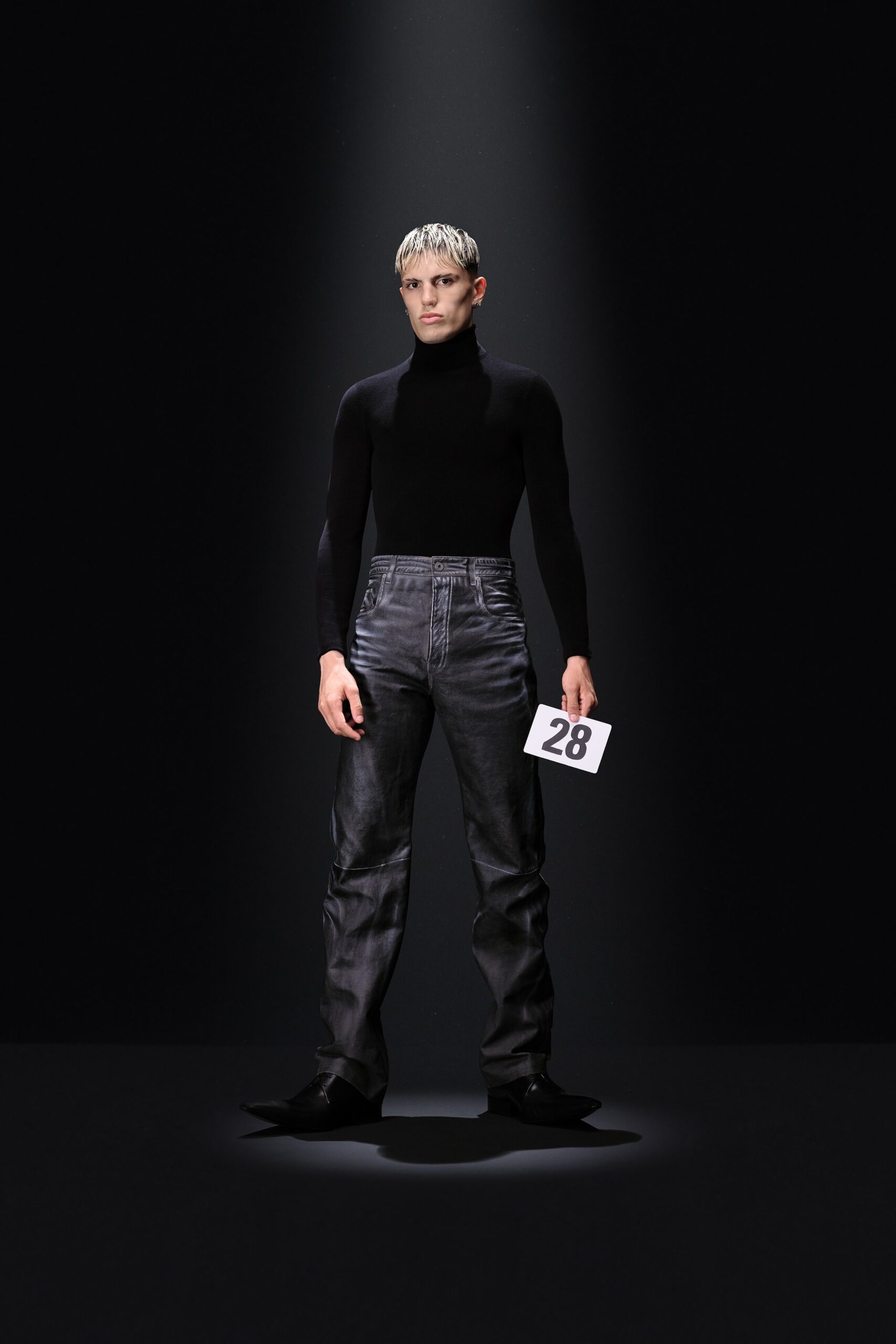 black fitted turtleneck and gray denim pants