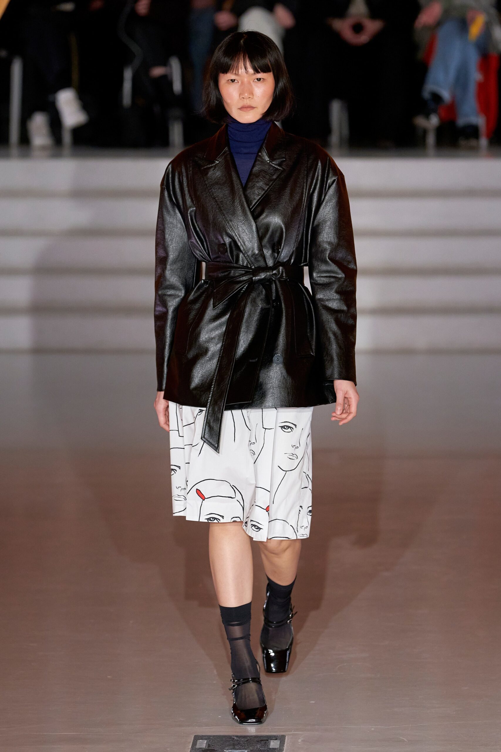 black leather long-sleeve collared fitted belted jacket