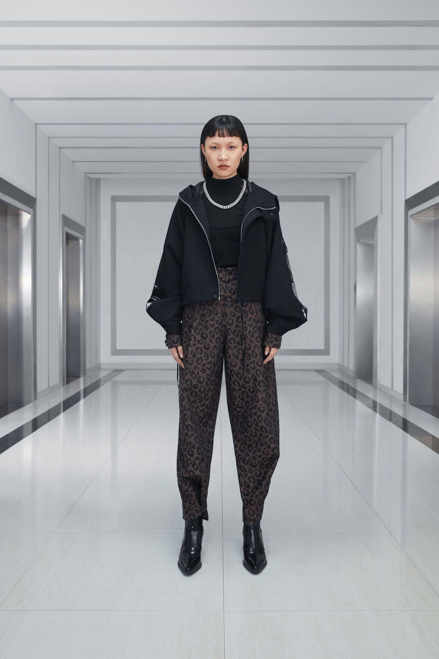 black fitted jacket with animal-print pants