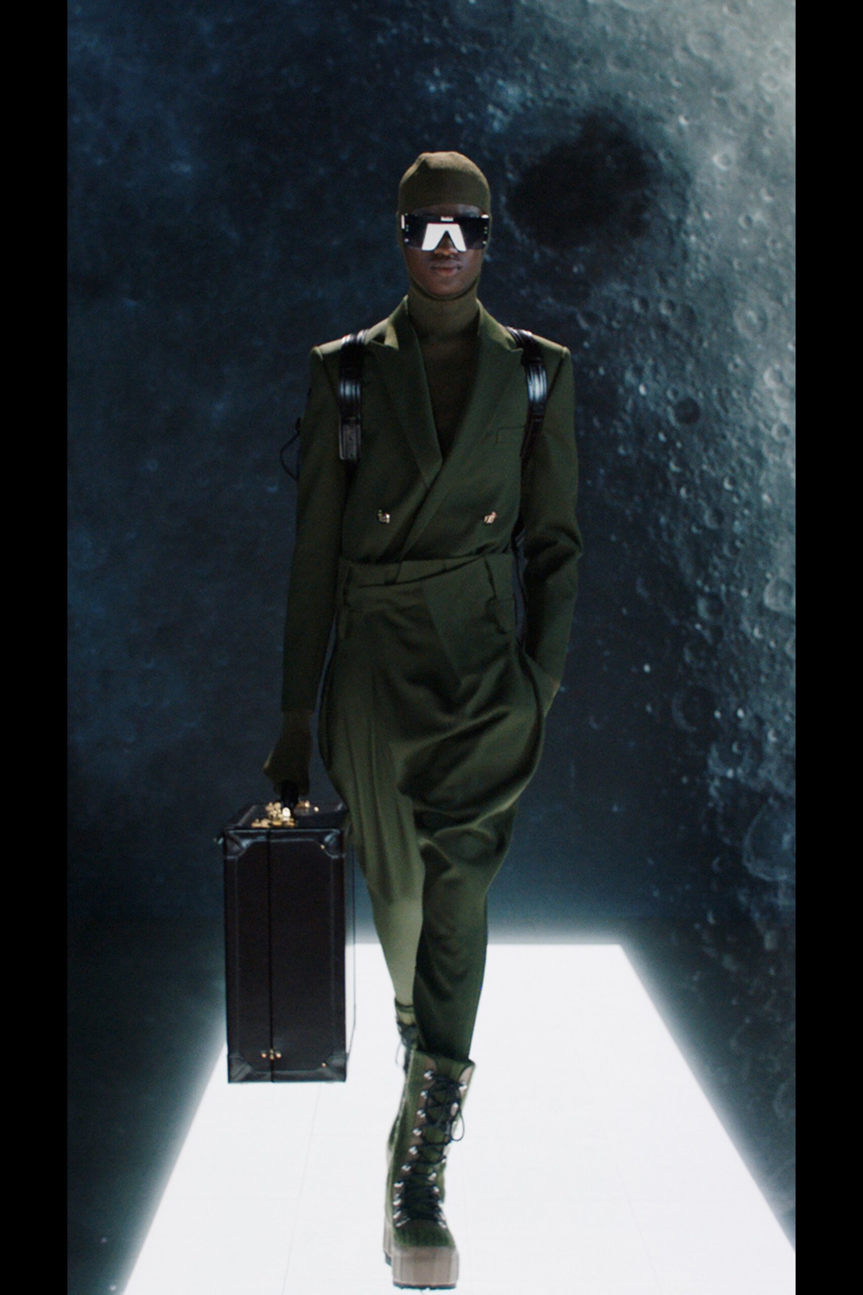 green fitted suit with accessories