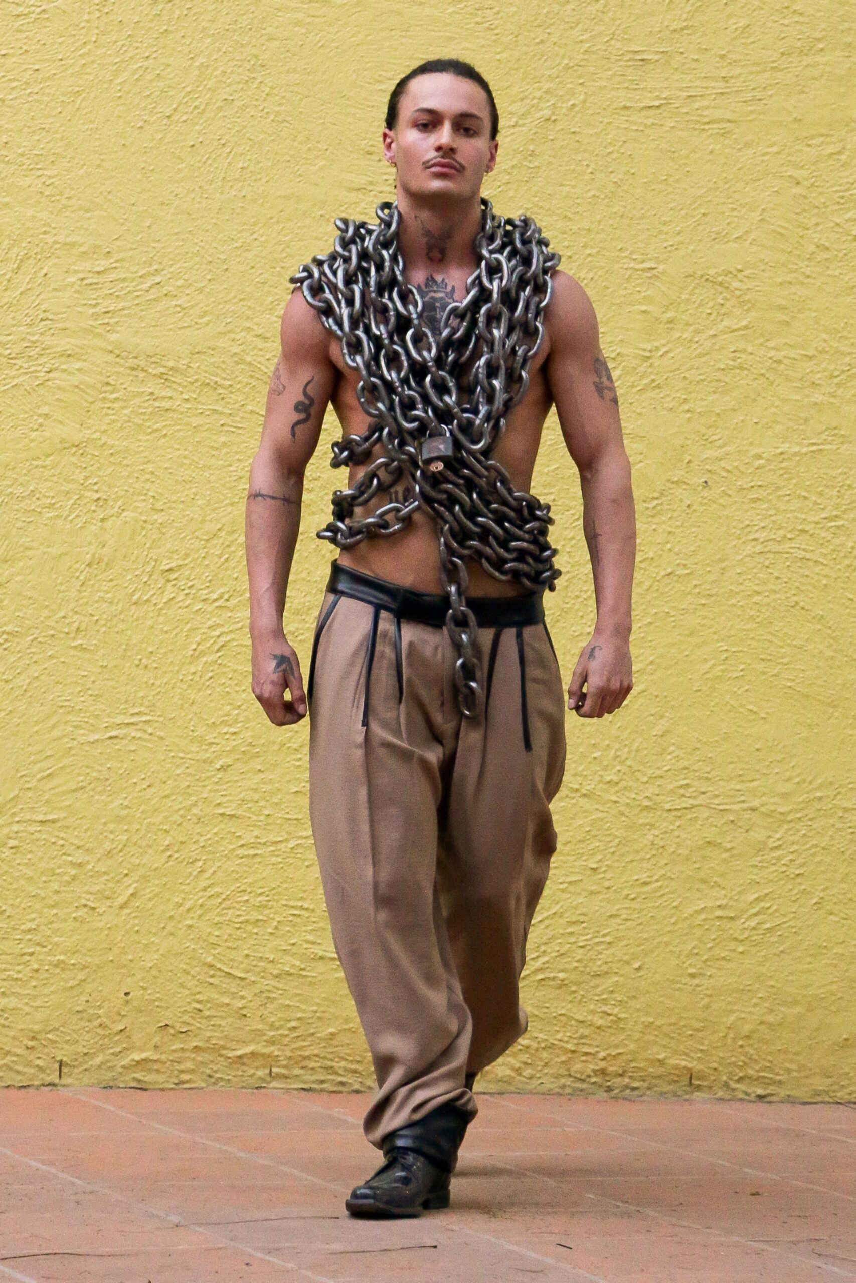 beige relaxed pants with chains