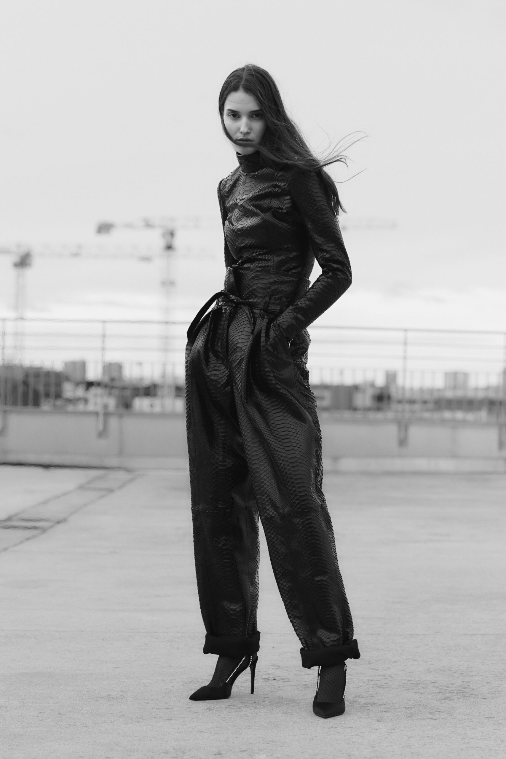 black leather fitted top and relaxed pants