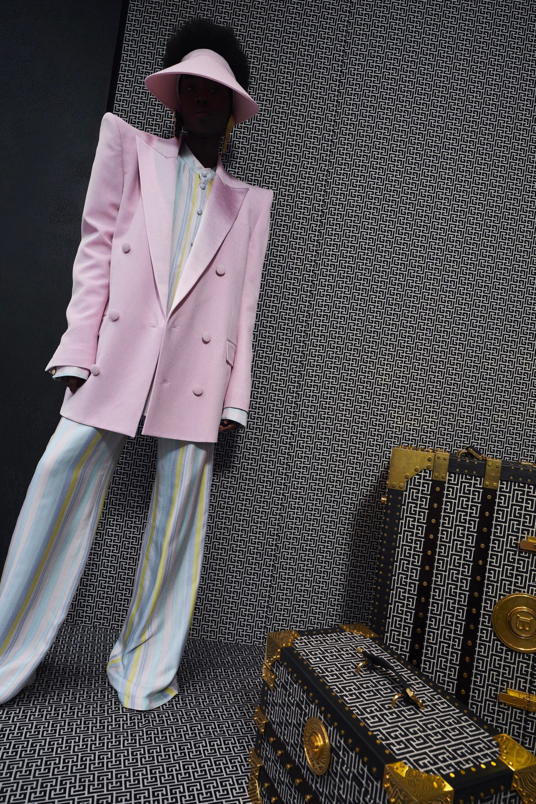 pink tailored blazer with multi-striped pants