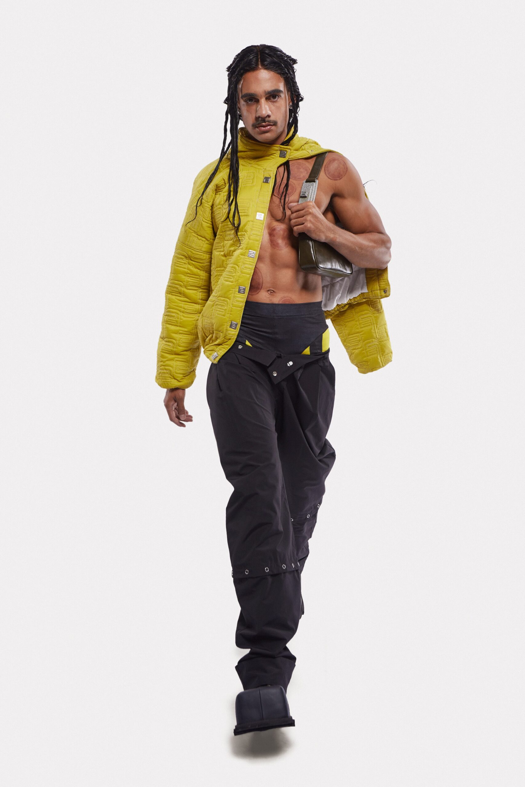 yellow vinyl relaxed jacket and black cargo pants