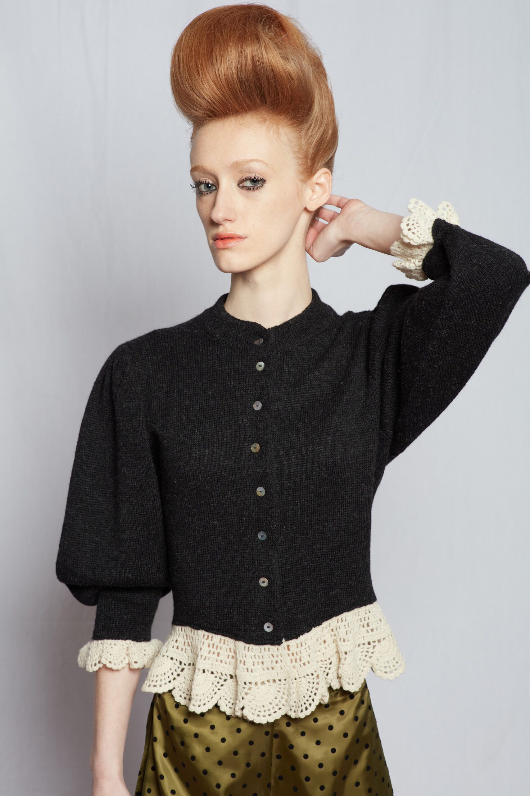 black wool top with green skirt
