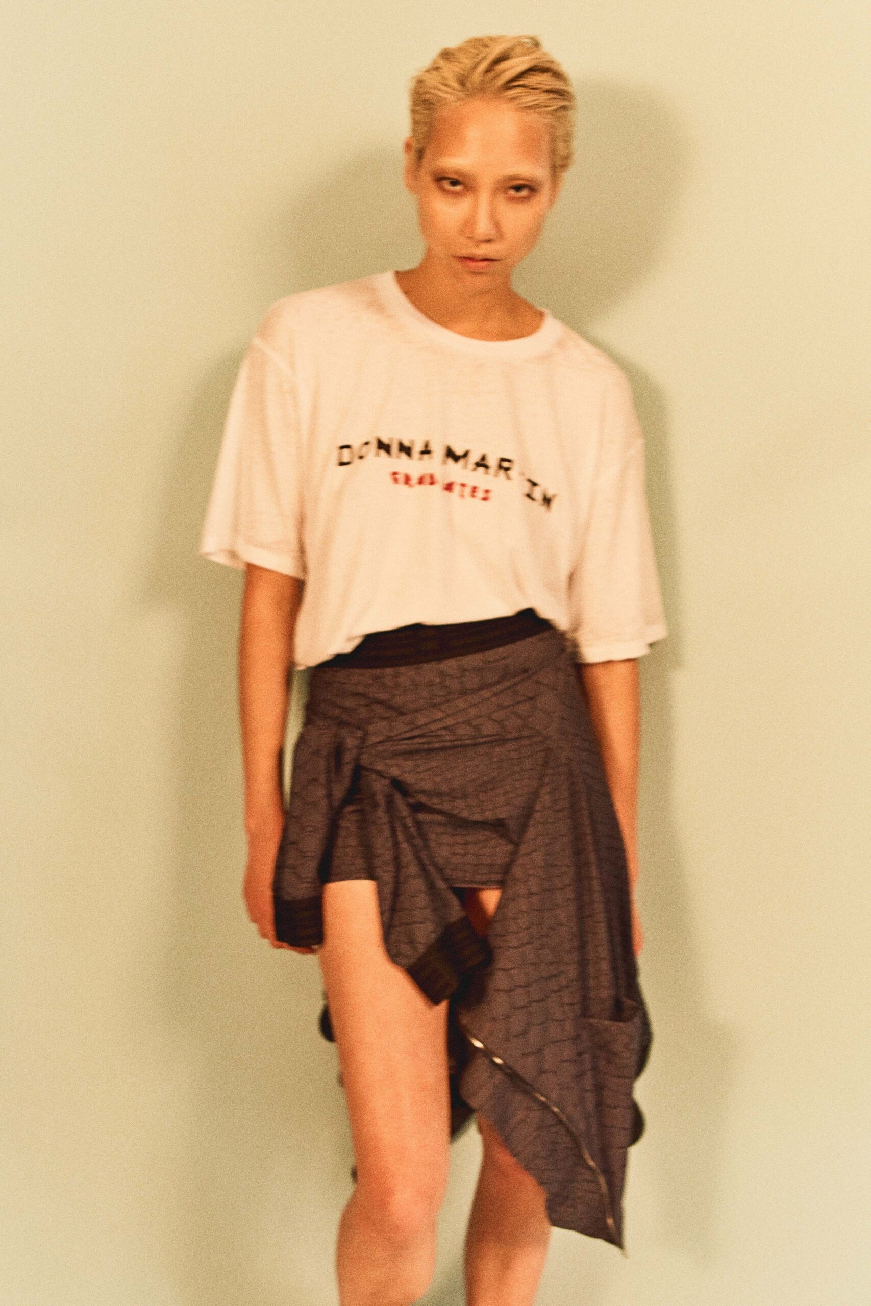 white relaxed t-shirt and gray skirt
