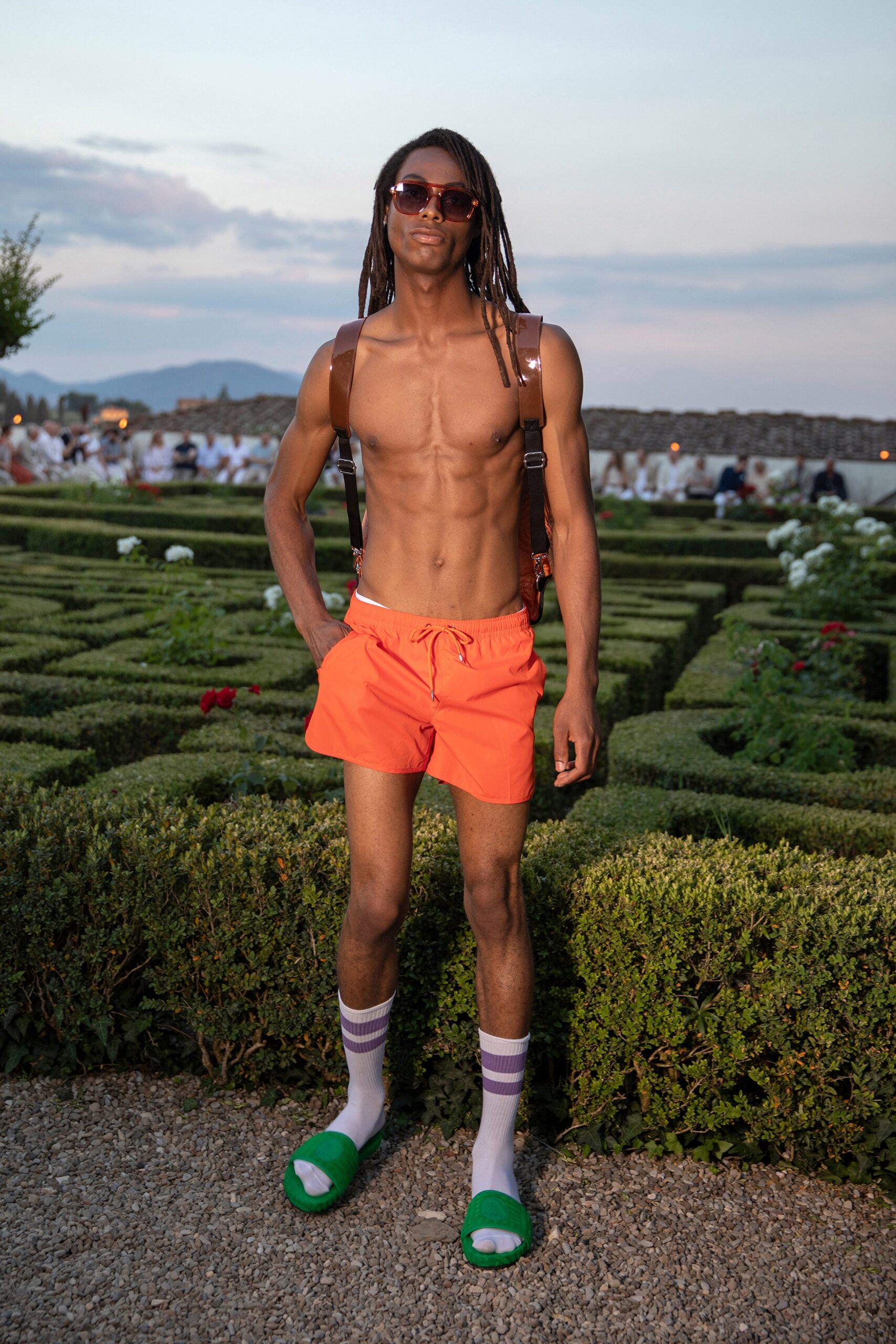 orange shorts with green shoes