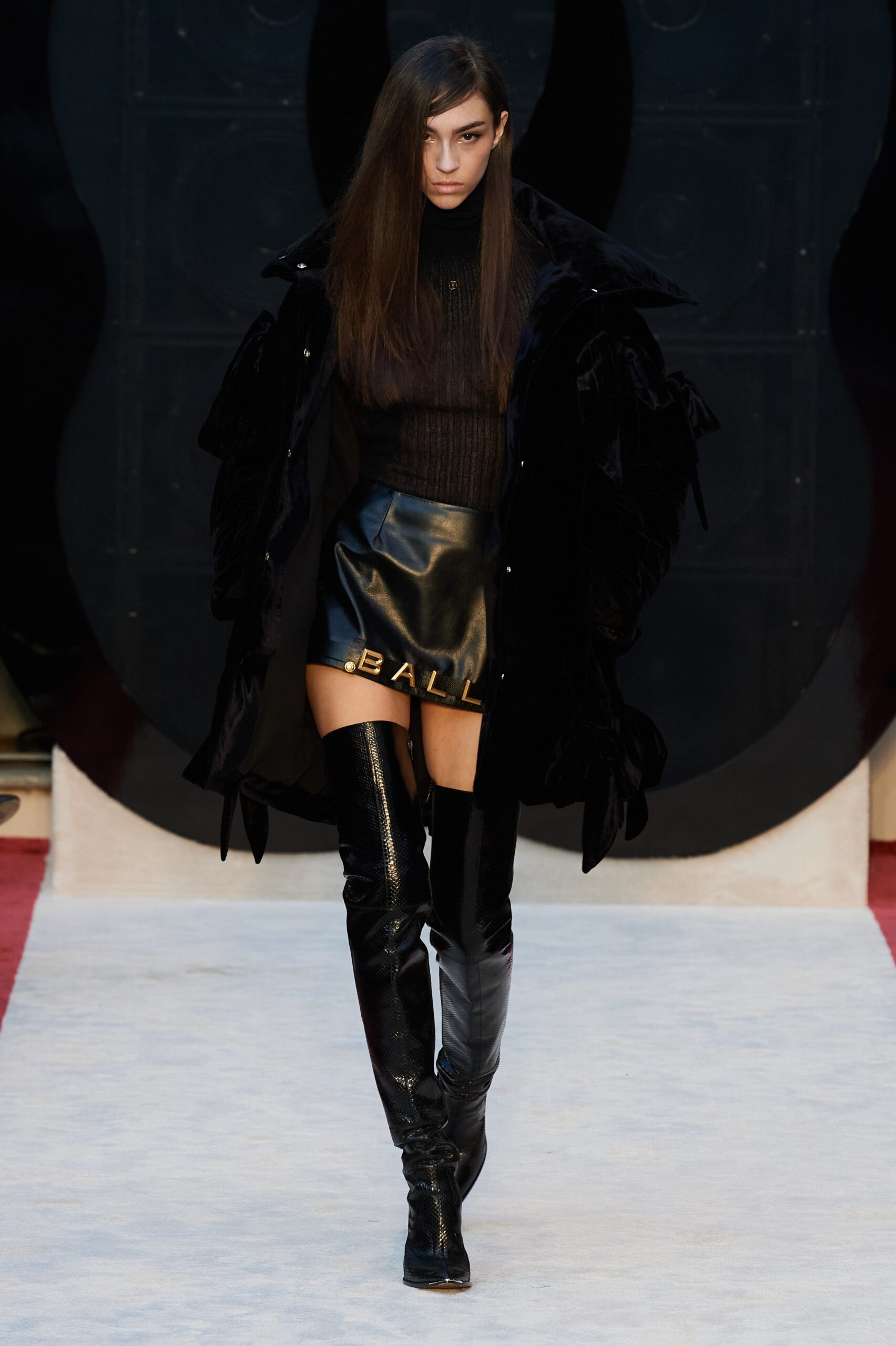 black velvet coat and leather skirt