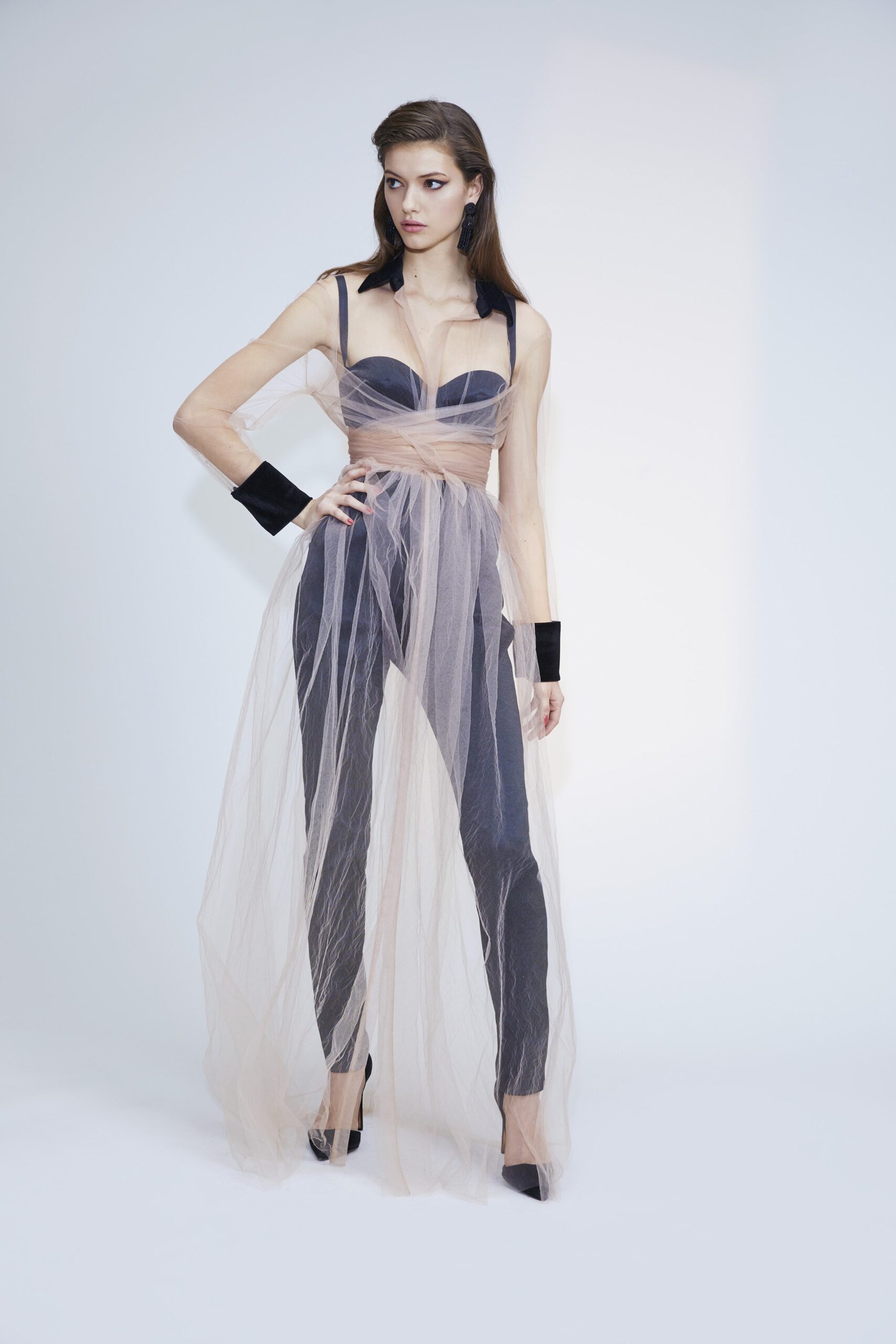 black fitted jumpsuit with beige cape