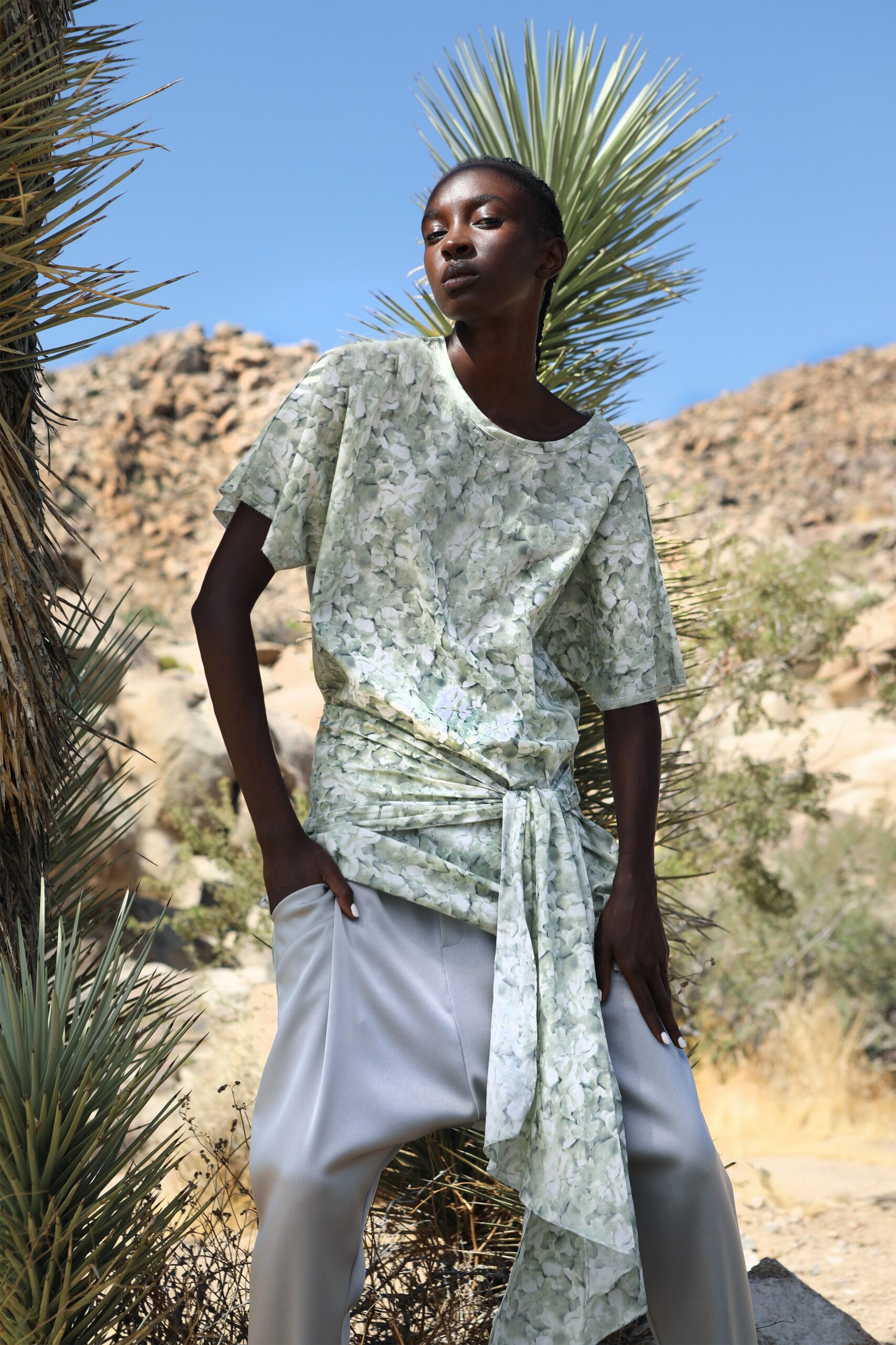 green printed relaxed top with silver pants