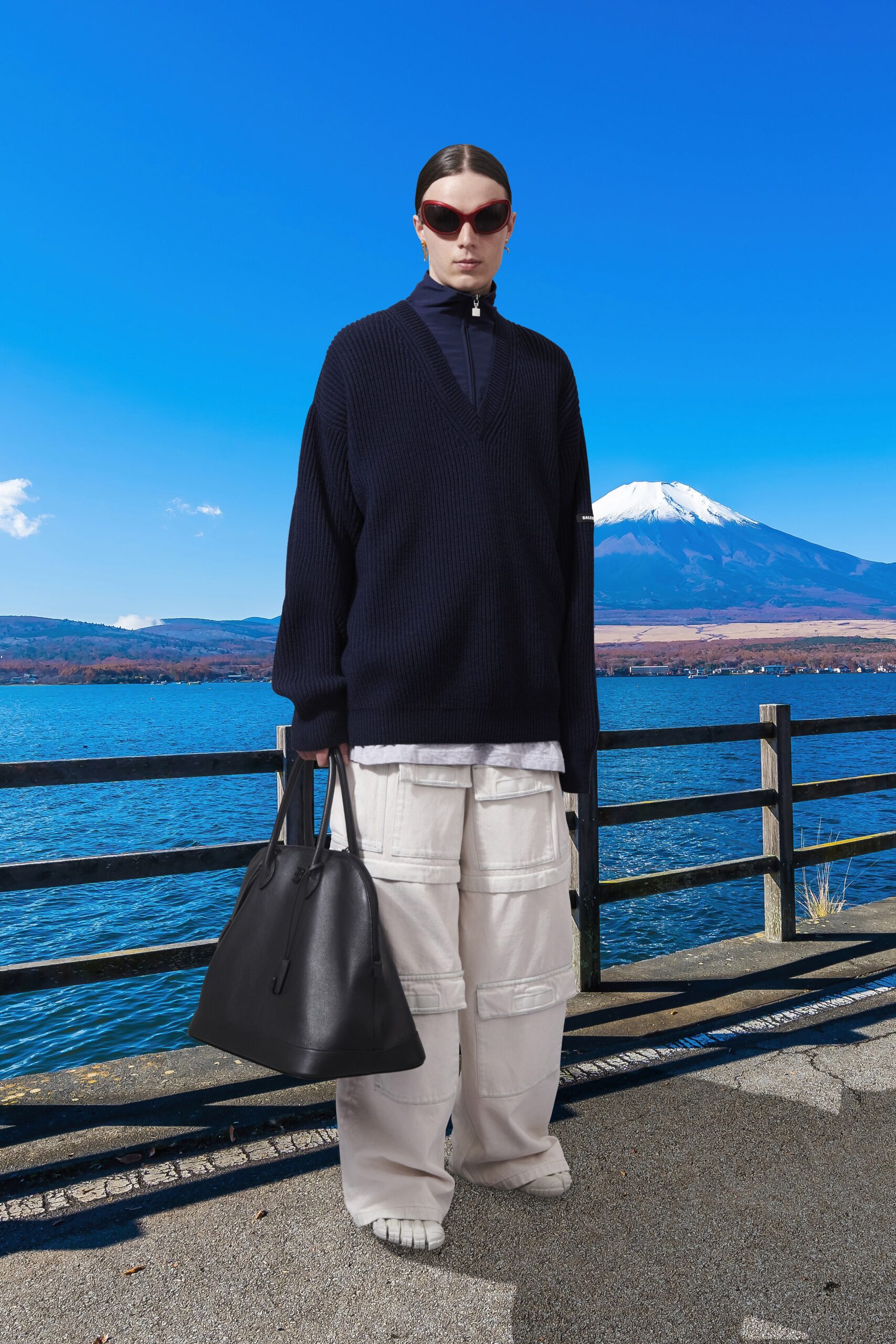 black oversized sweater and white cargo pants