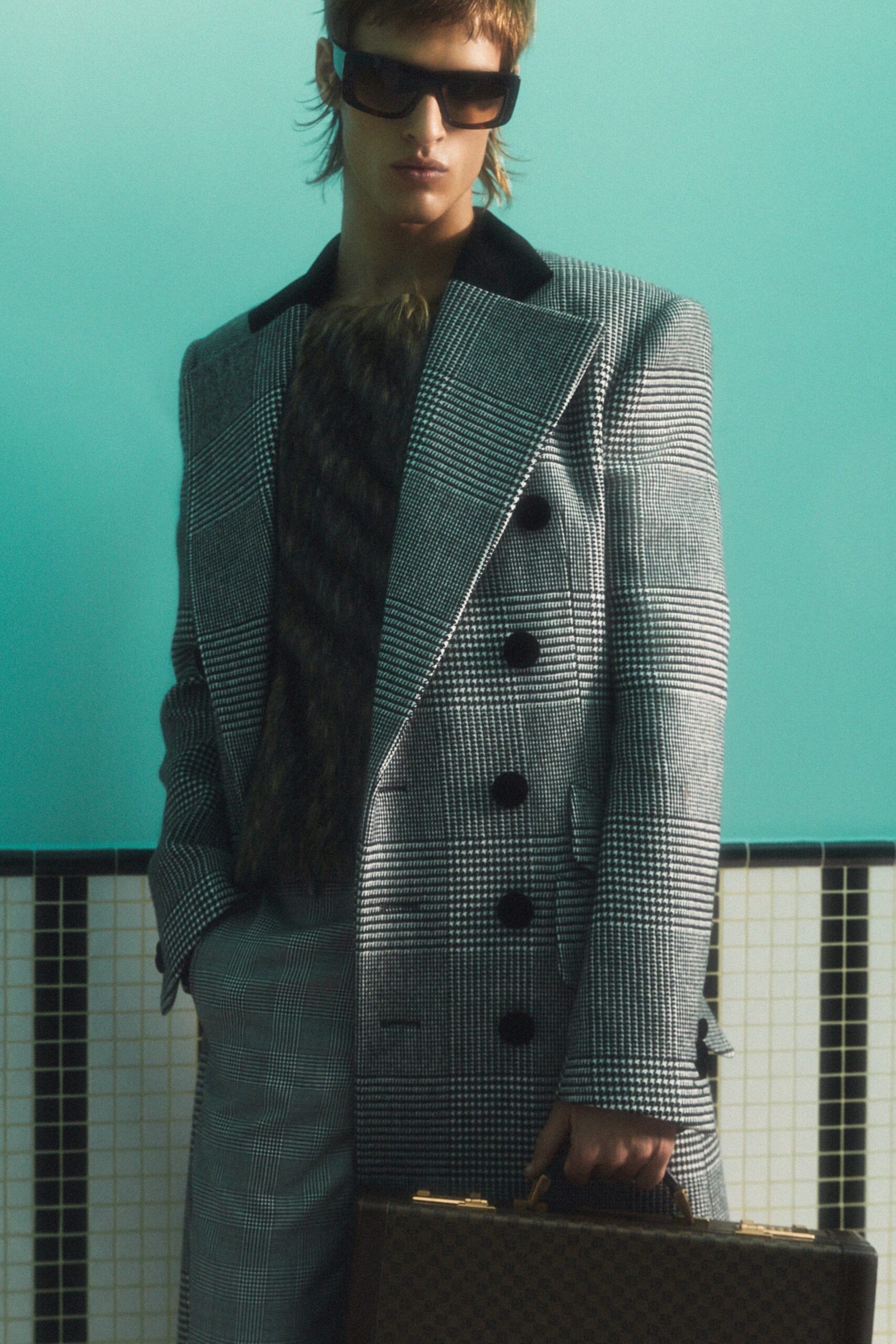 tailored gray coat with sunglasses