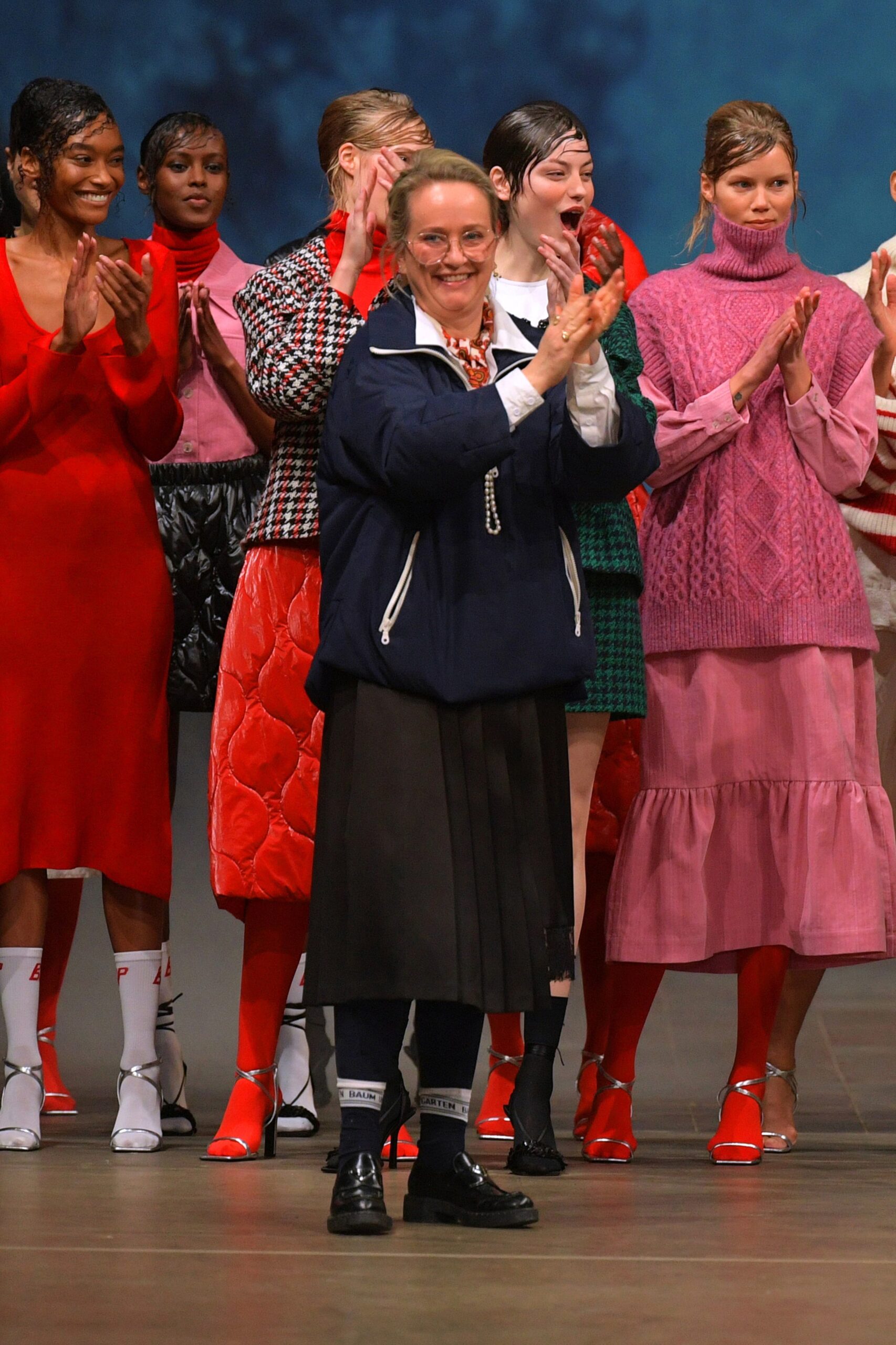 red pleated midi dress and pink knit dress