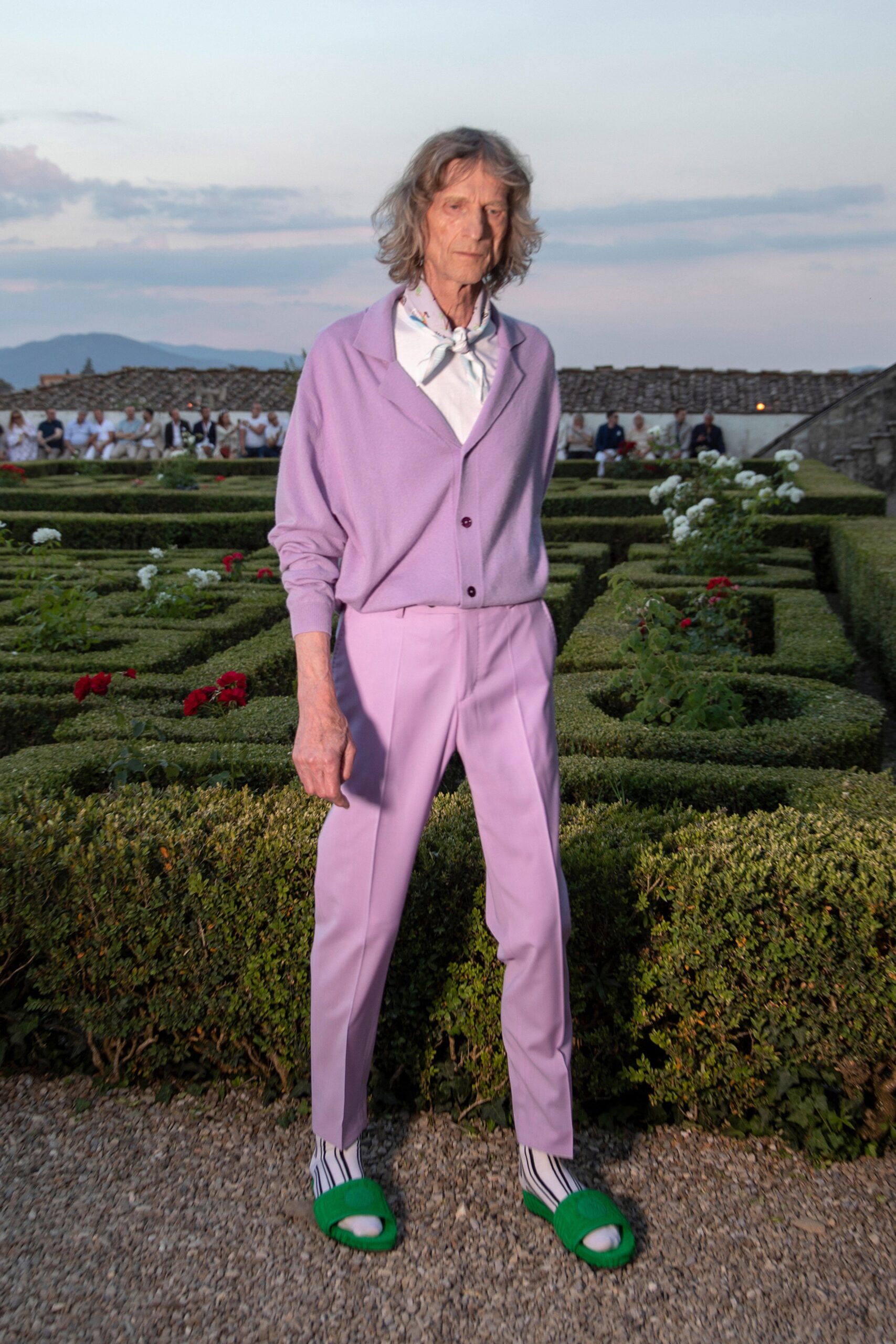 purple tailored suit with green shoes