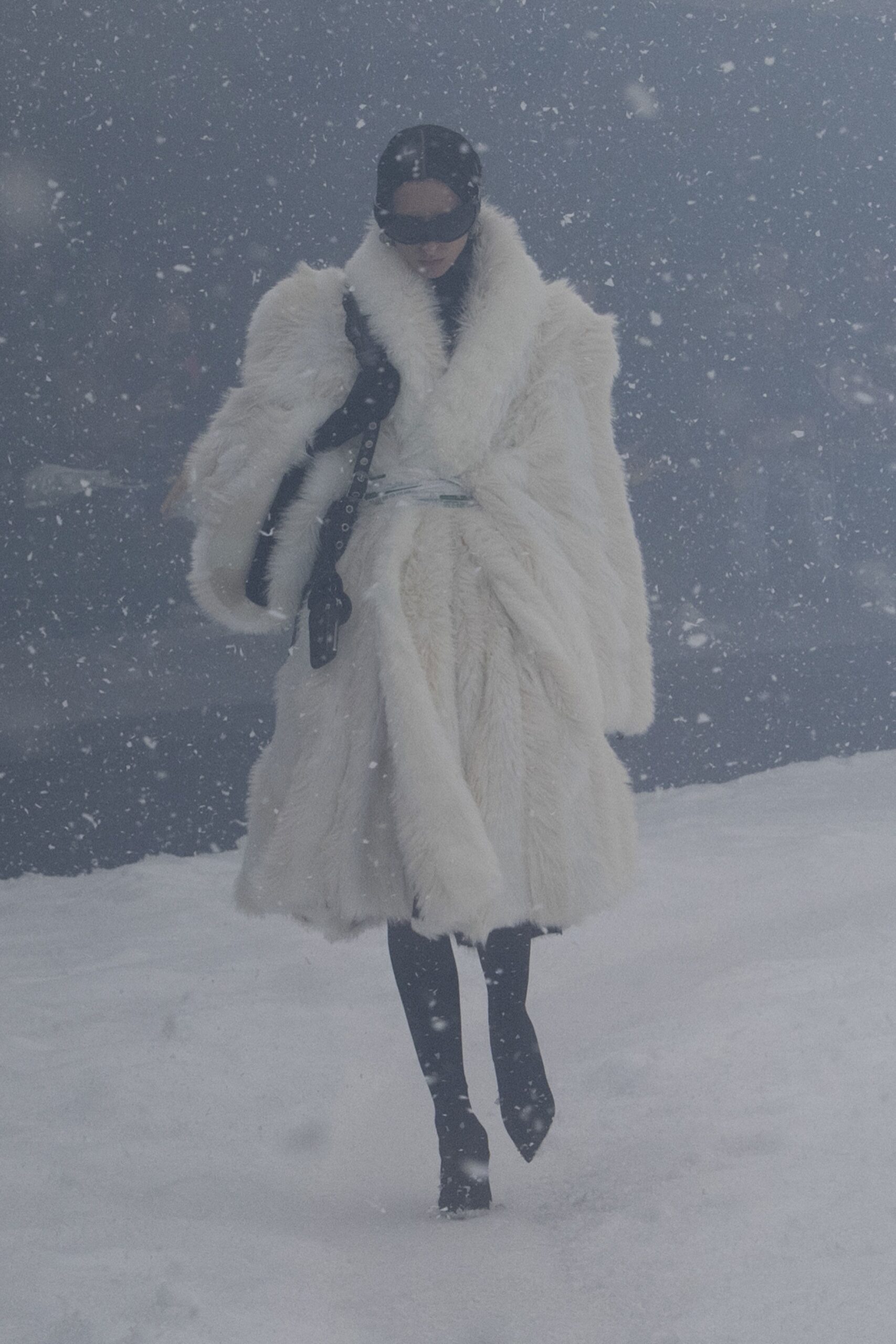 white fur coat with black pants