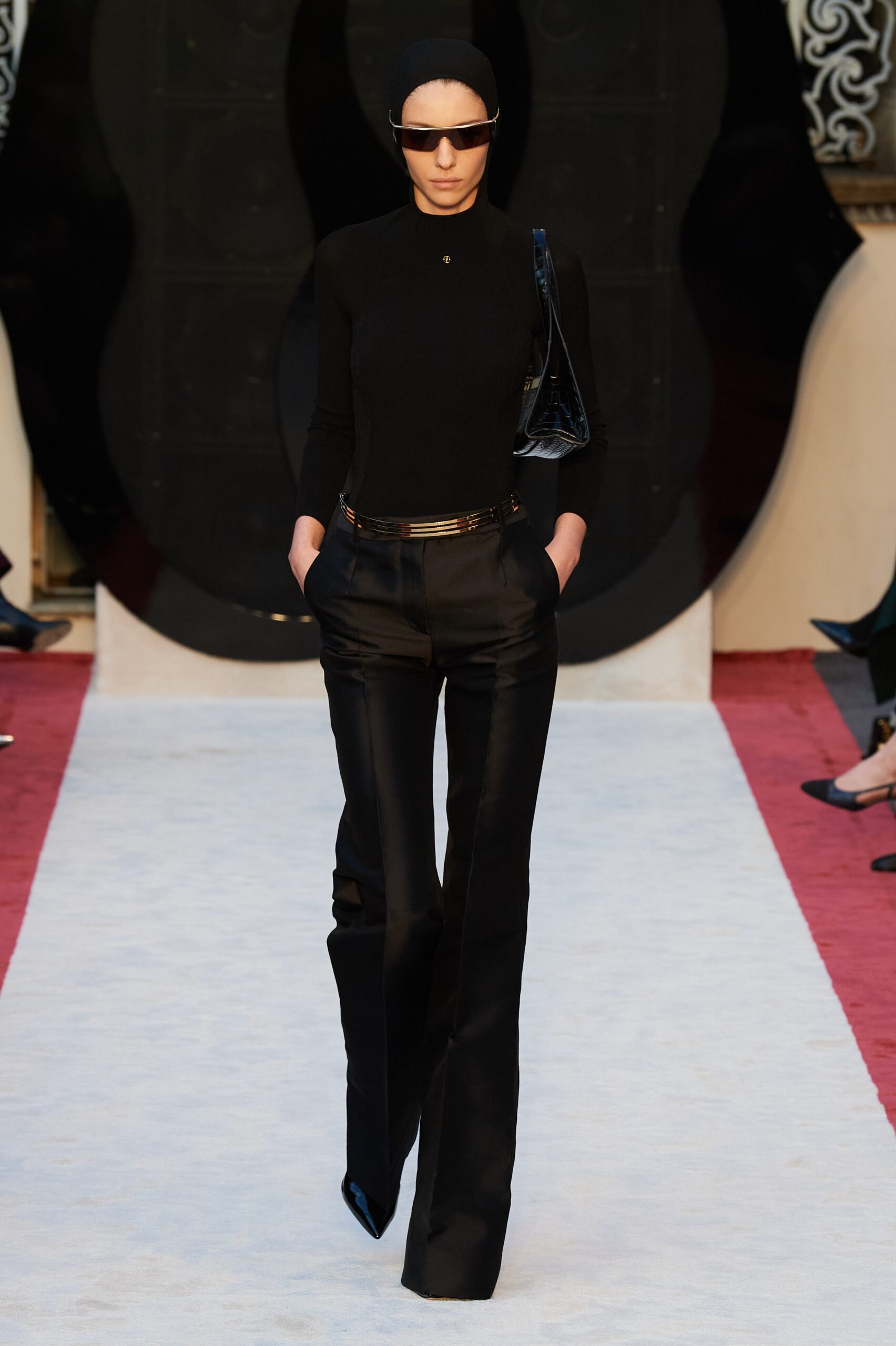 black fitted top and tailored pants