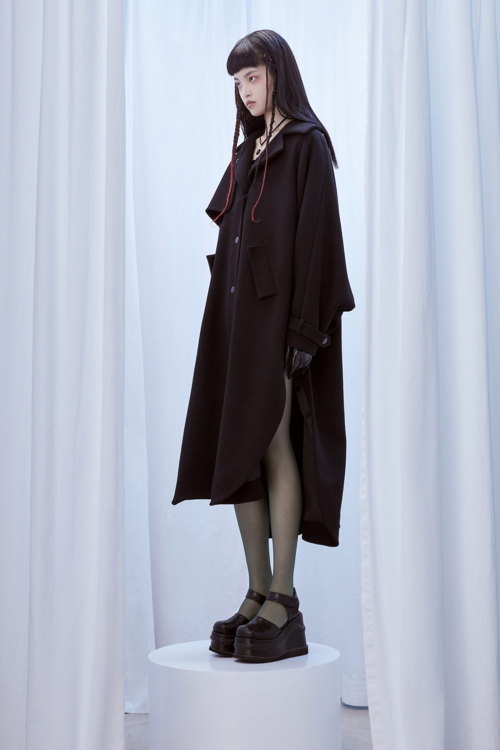 black wool long-sleeve collared oversized buttoned coat