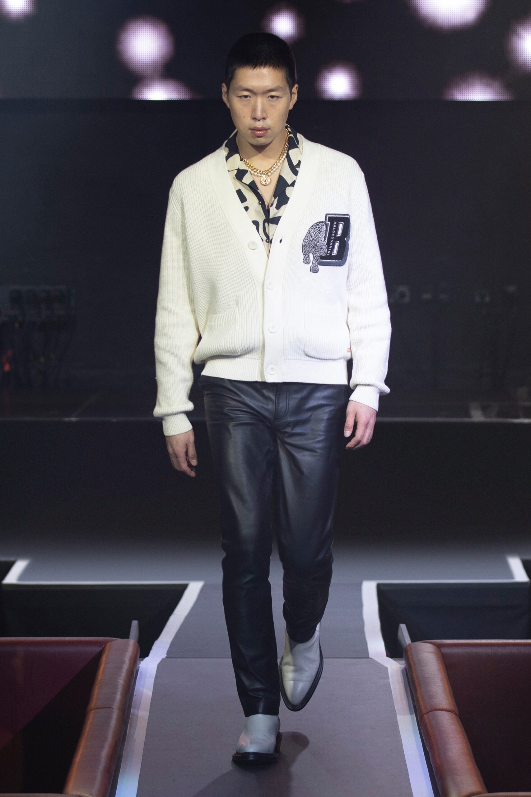 white cotton cardigan with black leather pants