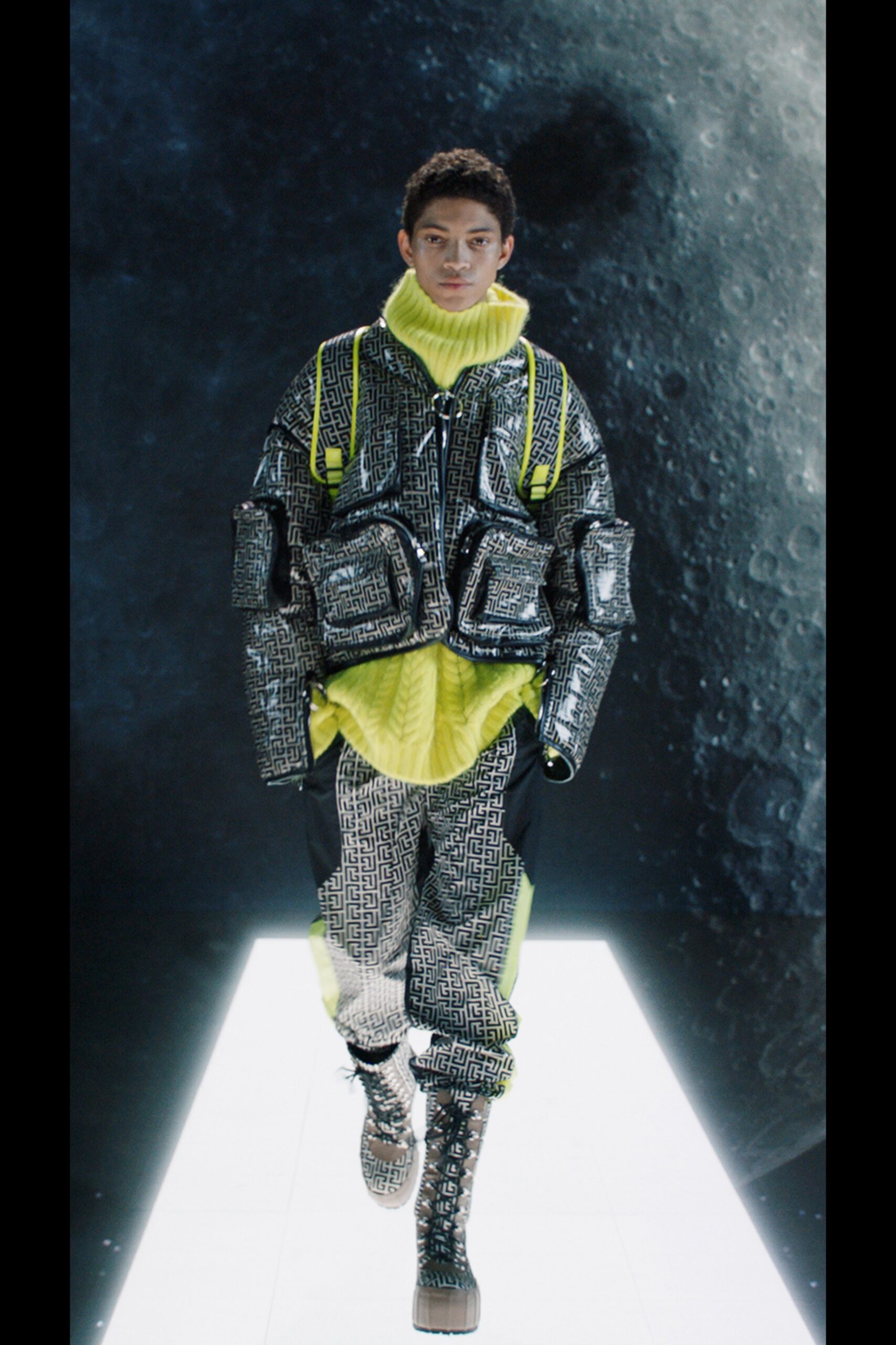 shiny silver vinyl jacket with yellow sweater