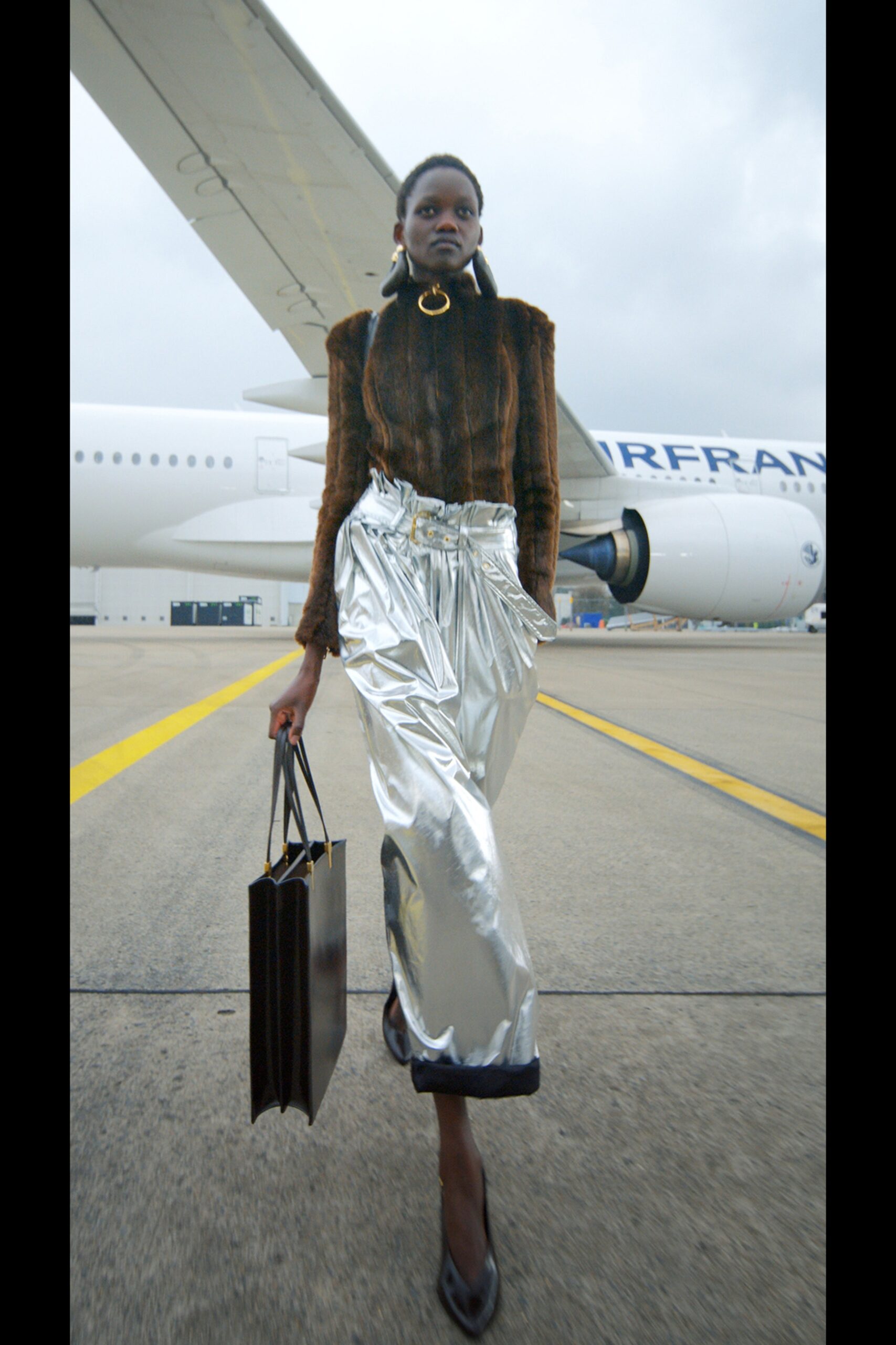 brown fur fitted top with silver pants