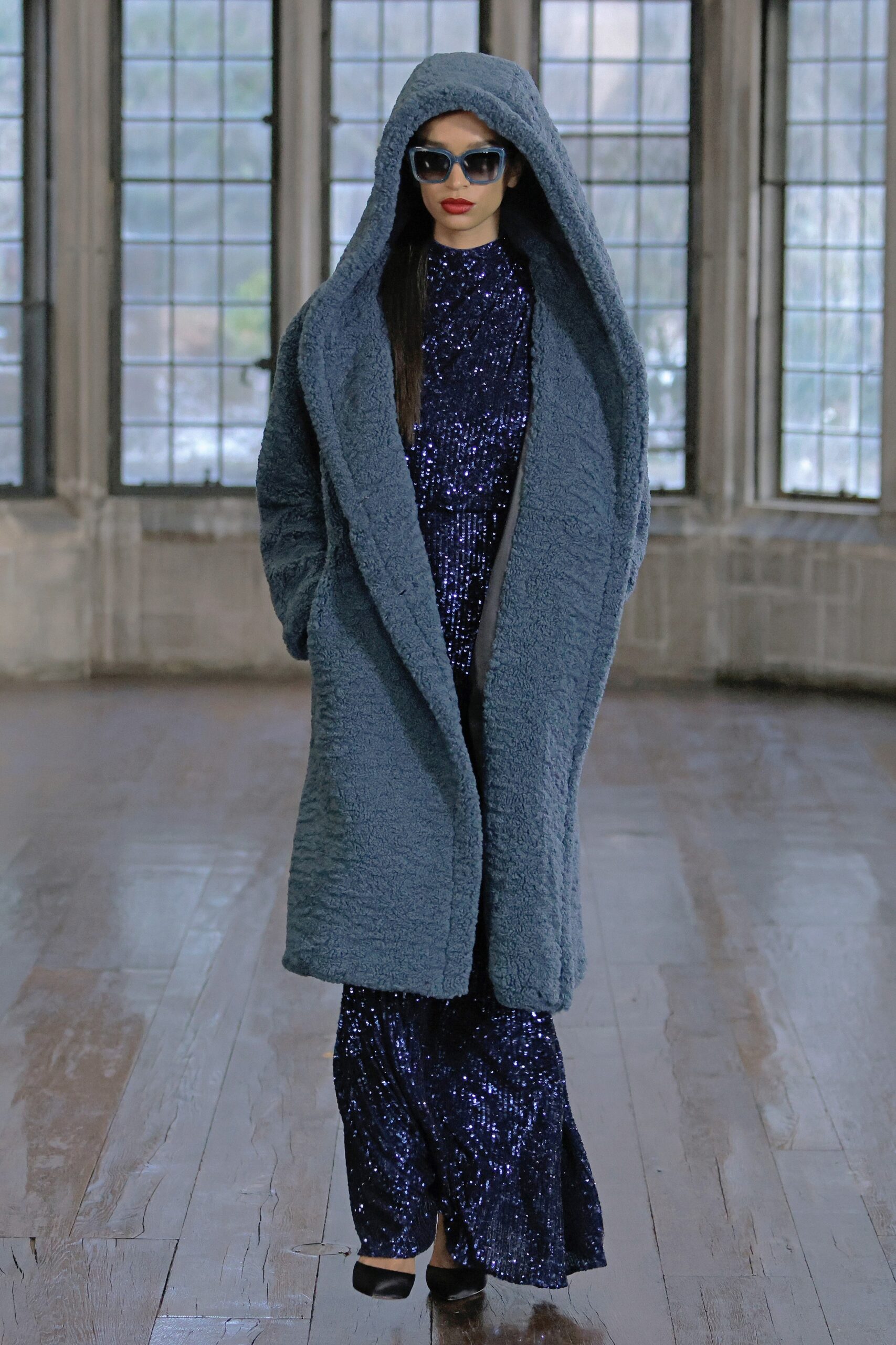 blue faux-fur coat and sequin gown