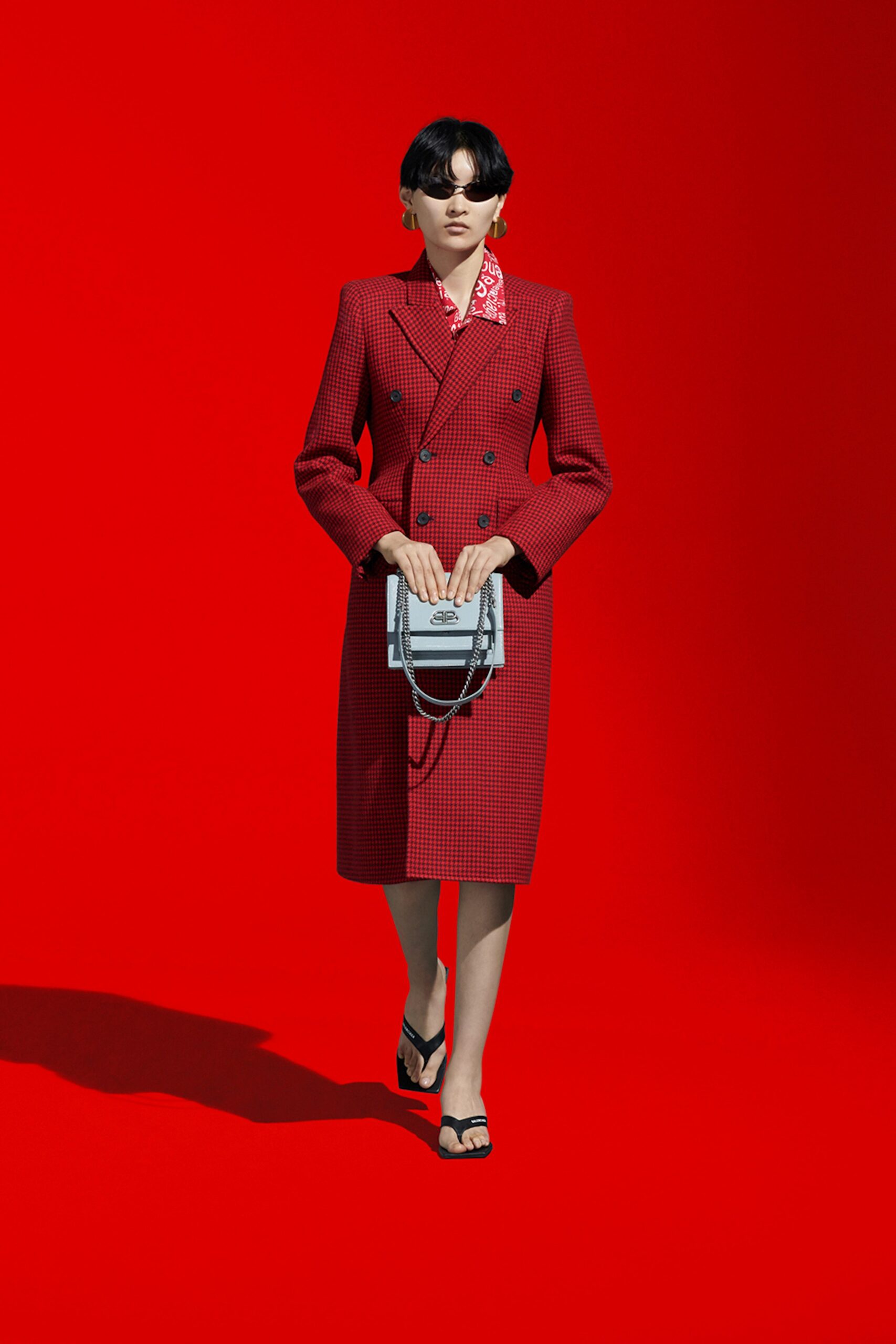 red tailored coat with blouse