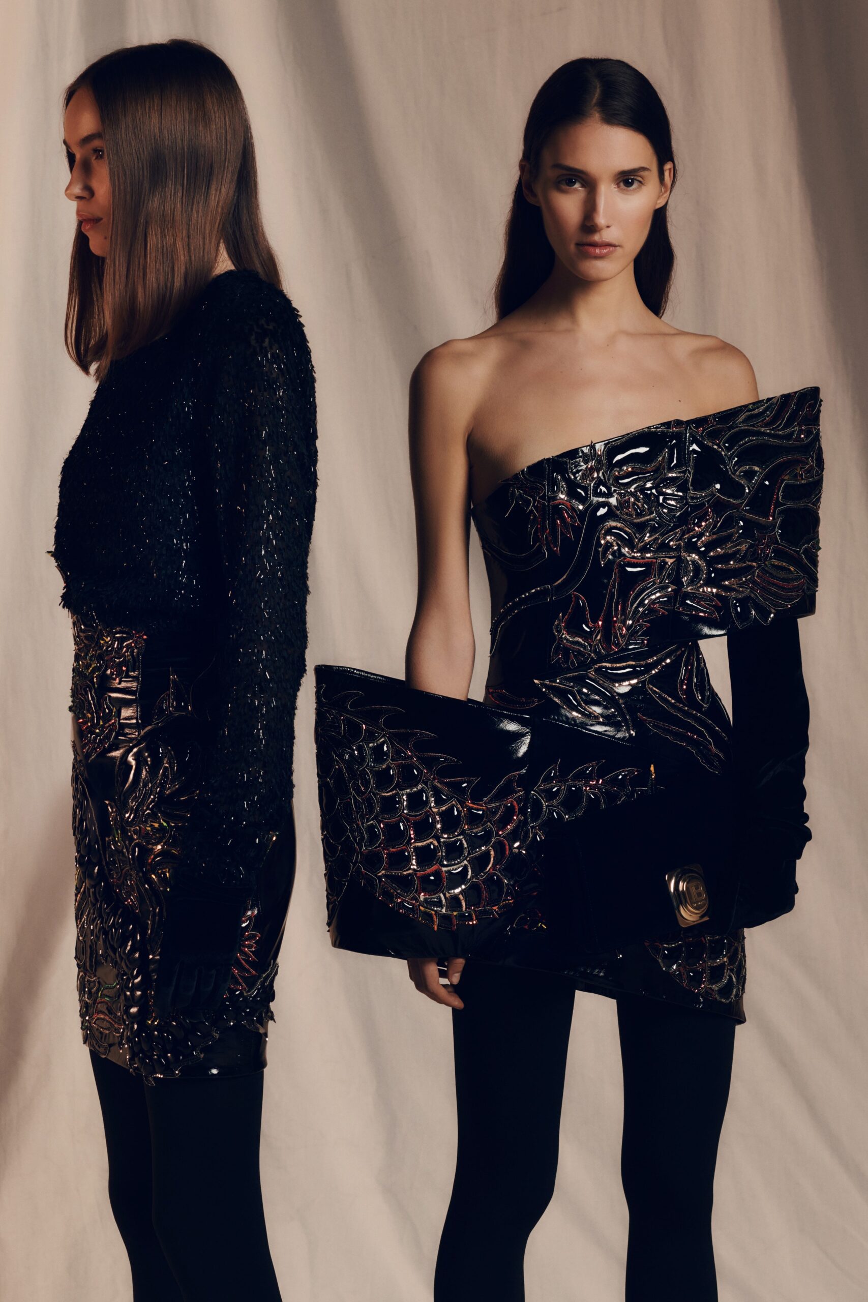 black vinyl strapless mini dress and fitted knit top