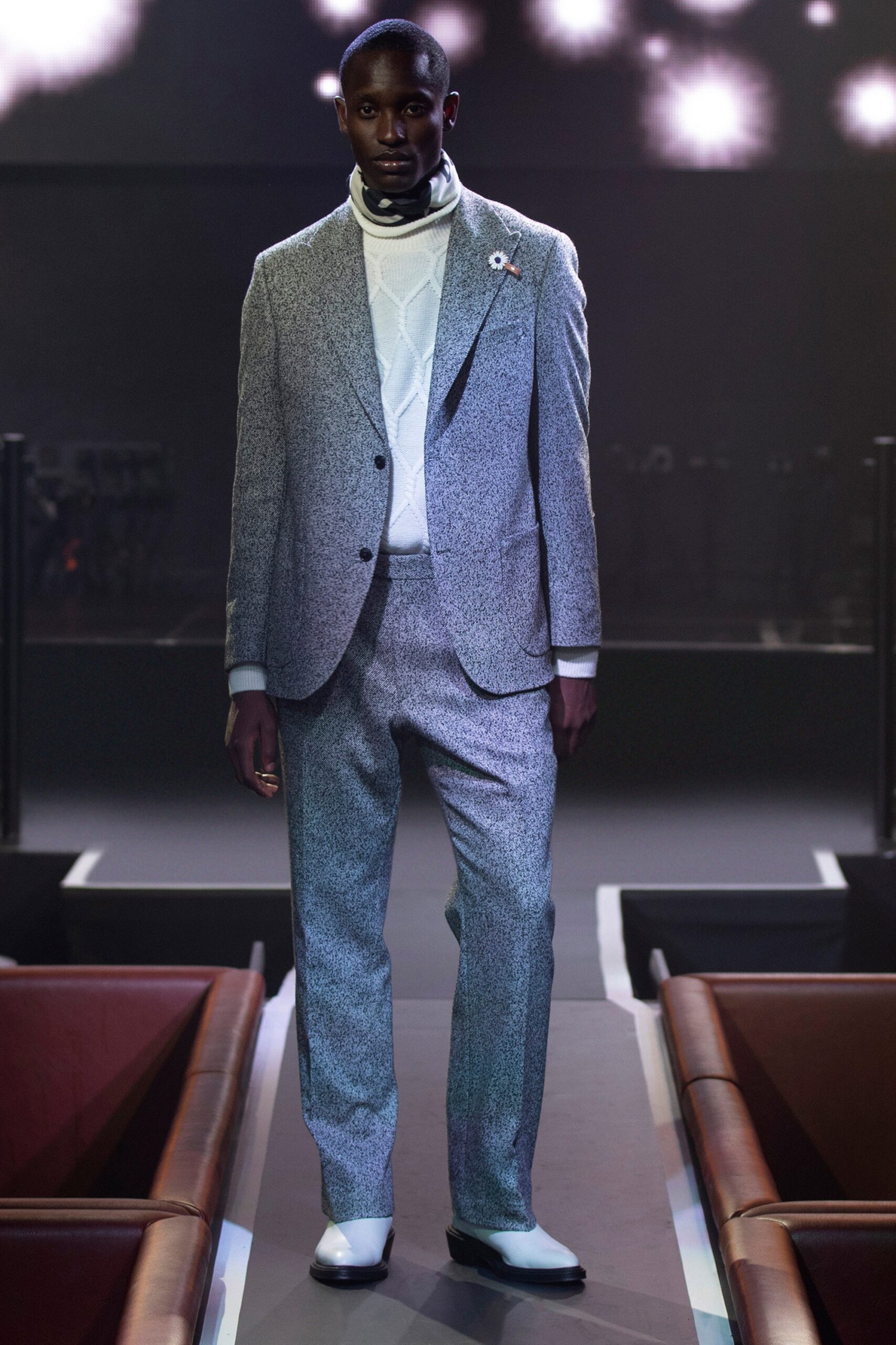 gray tailored suit with white t-shirt