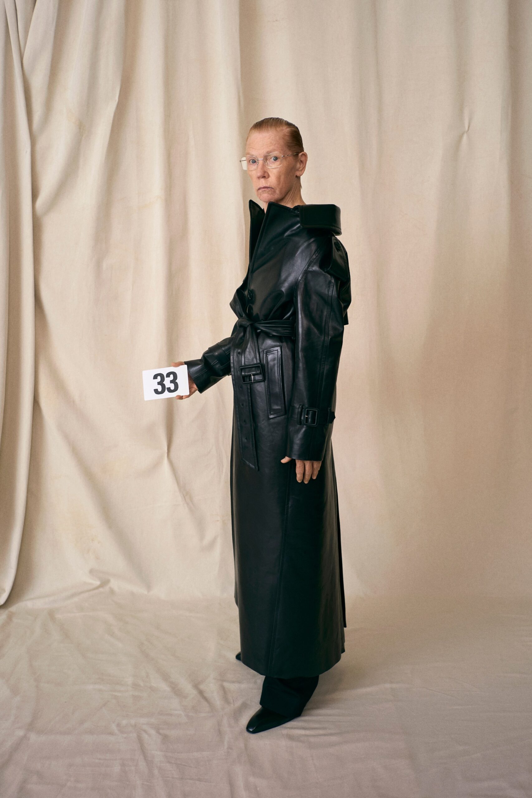 black leather belted coat