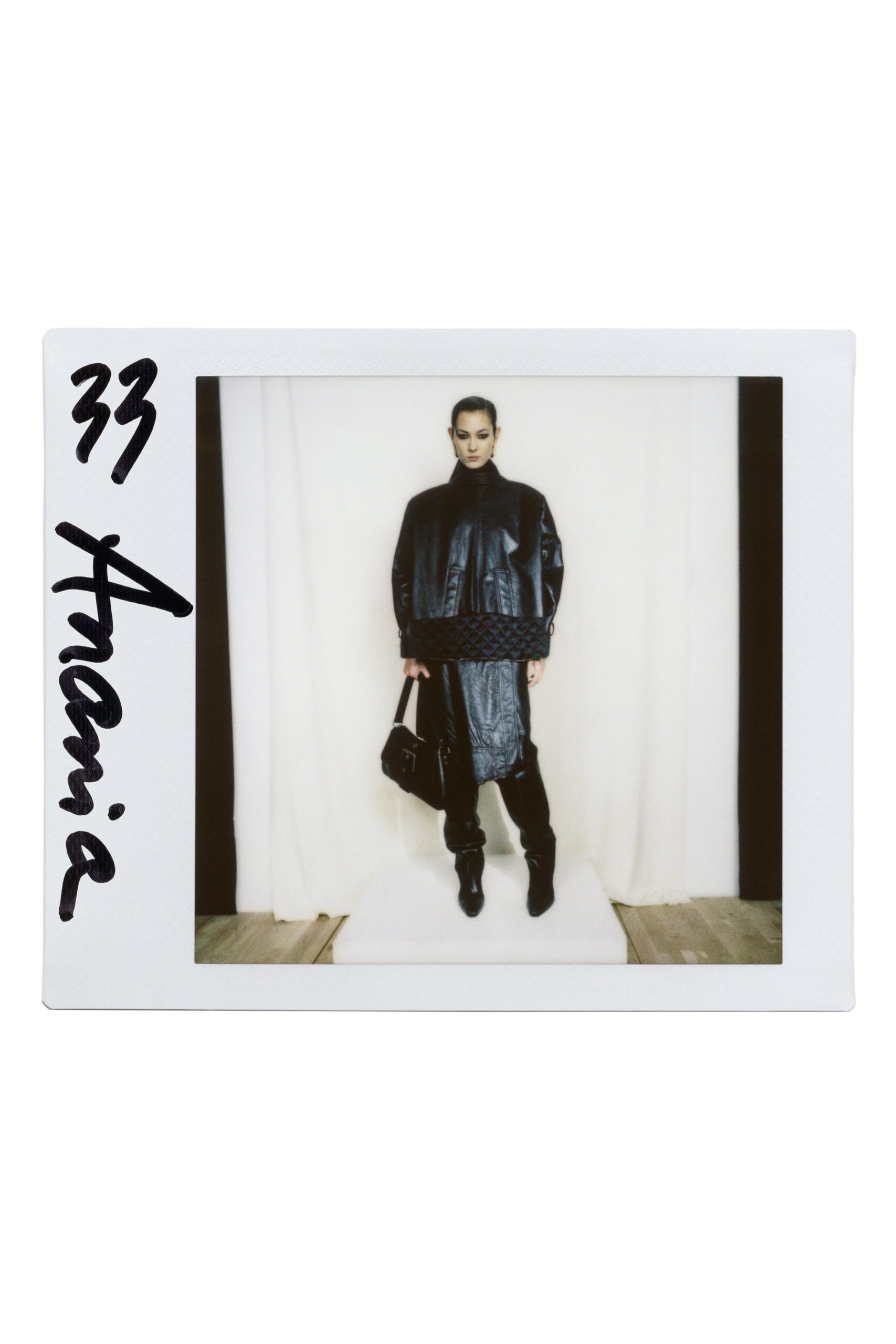 black leather long-sleeve collared oversized zippered coat