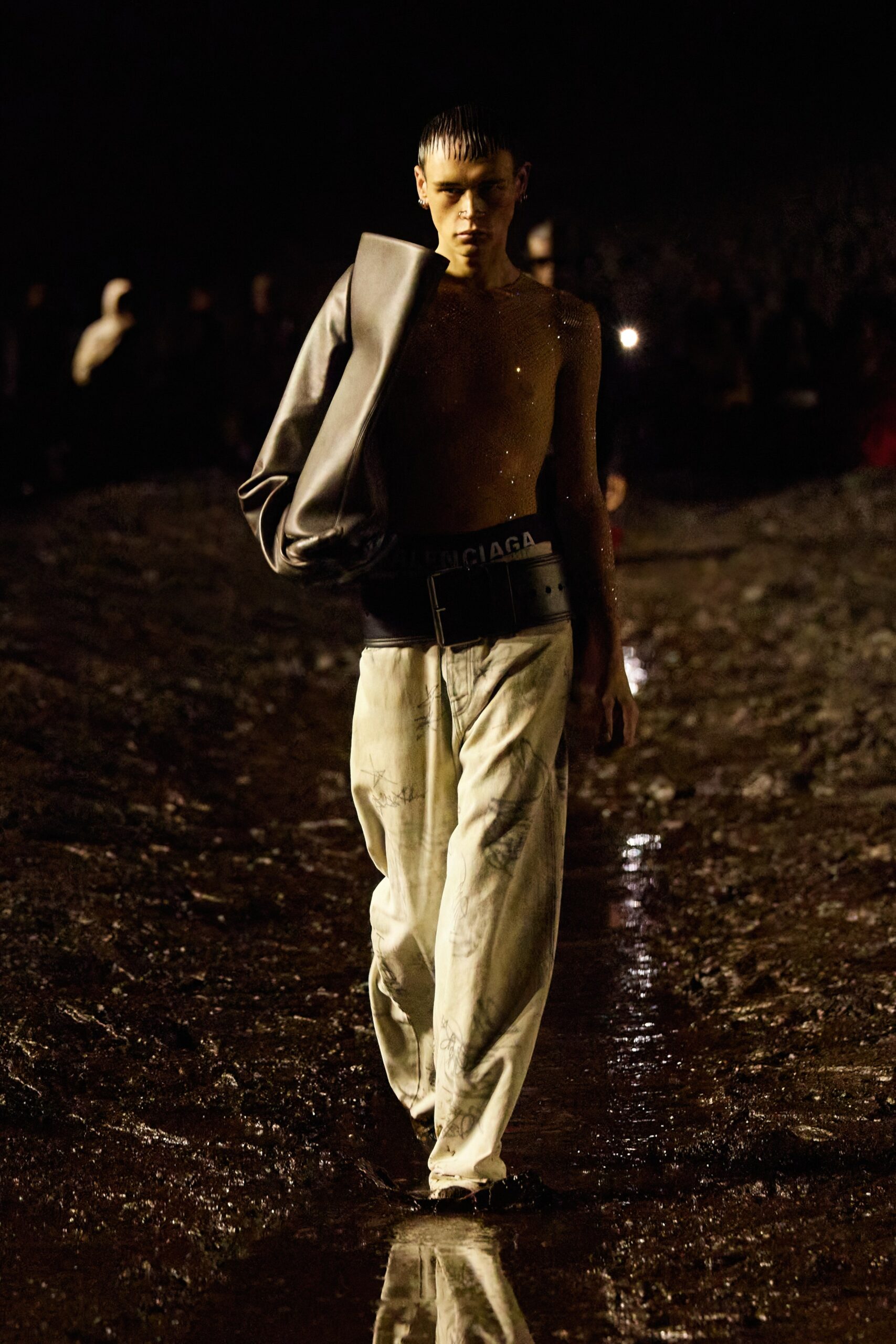 fitted gray leather jacket and relaxed white denim pants
