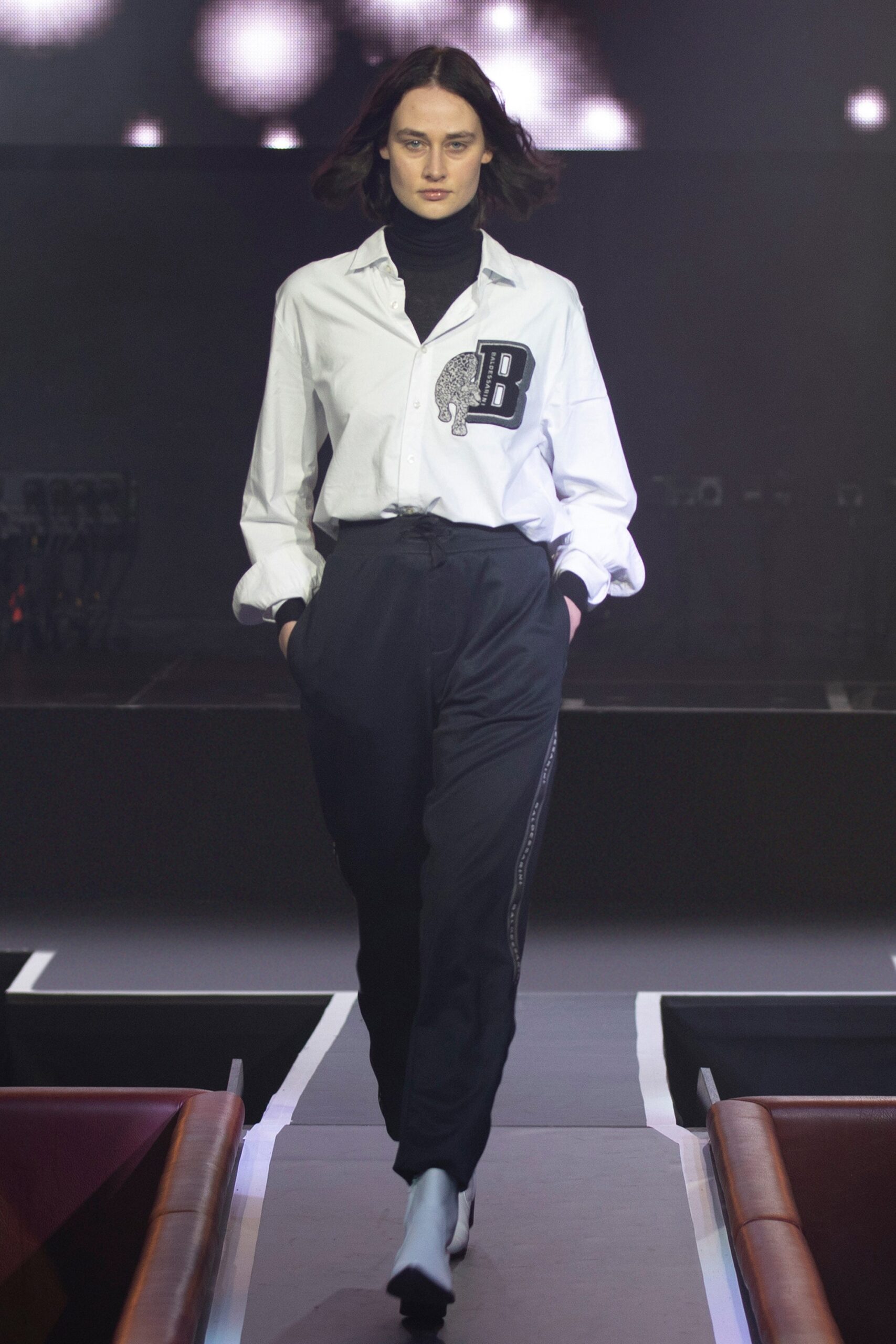 white relaxed shirt and black pants