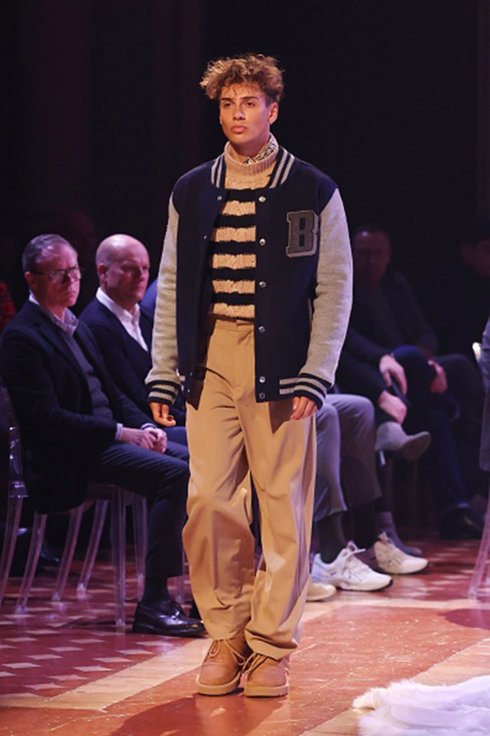 relaxed black jacket with beige sweater
