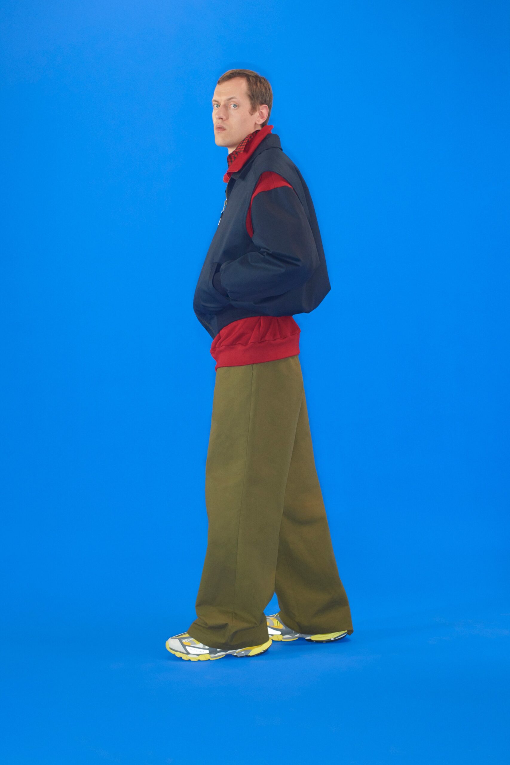 relaxed black and red jacket with wide-leg green pants