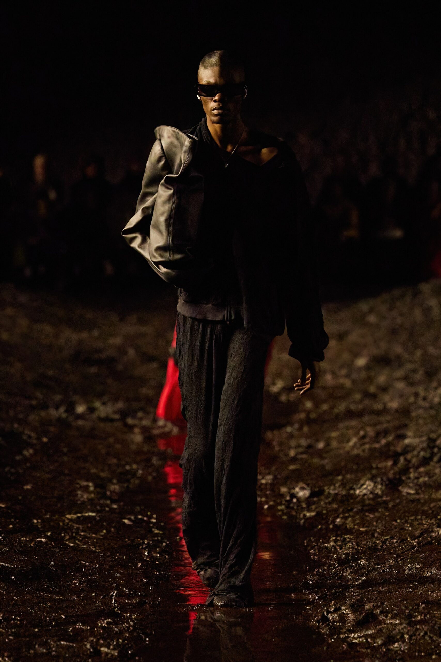 black oversized leather jacket and relaxed pants