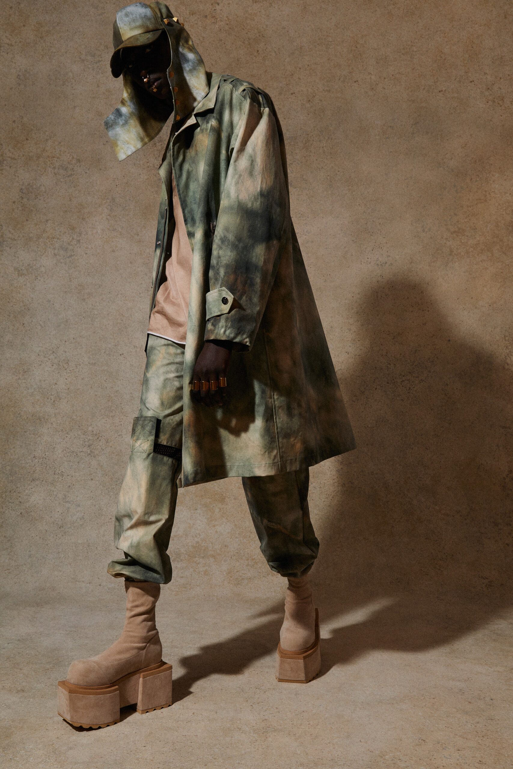 green and brown relaxed coat outfit