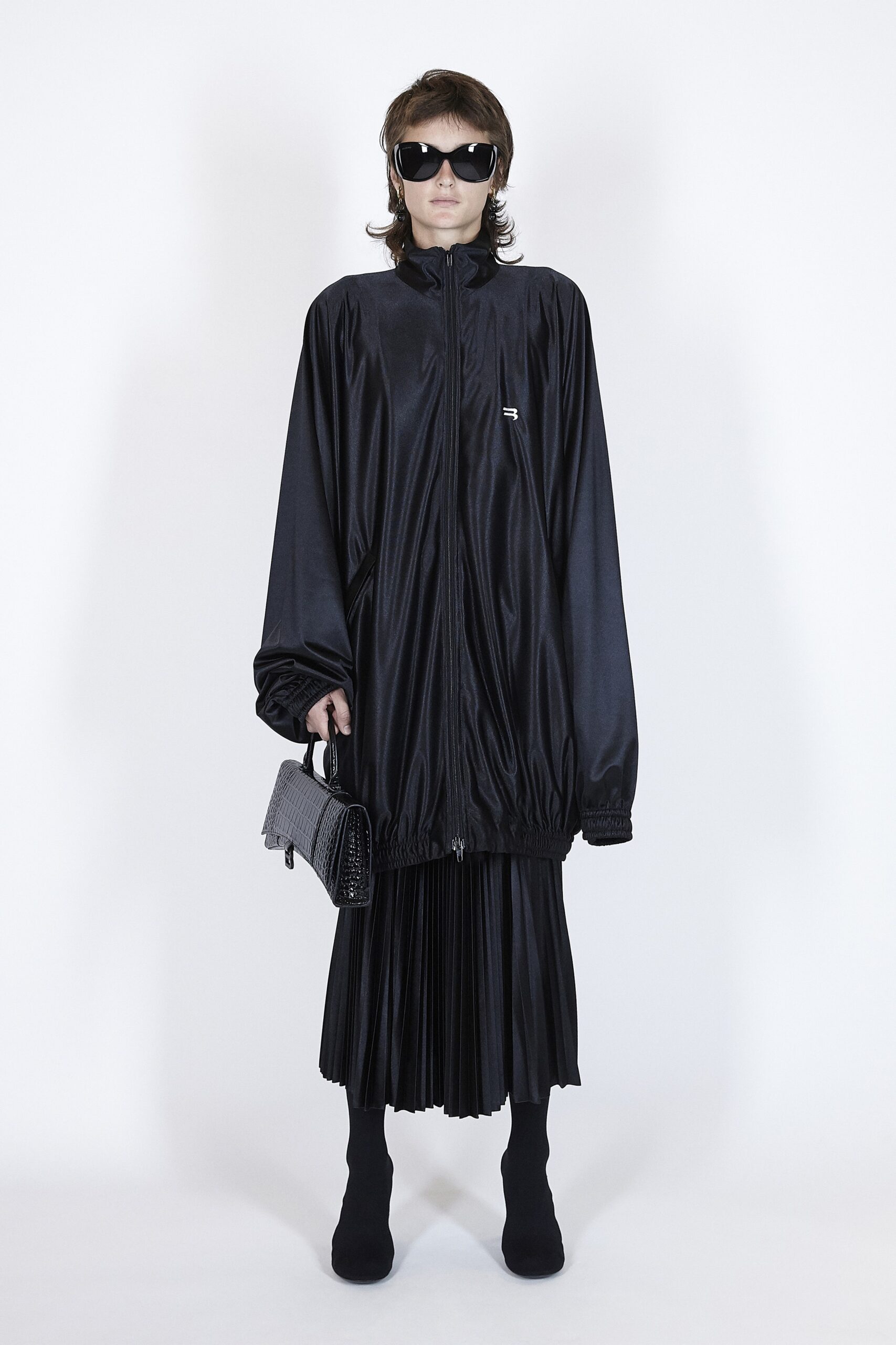 black oversized jacket and pleated dress