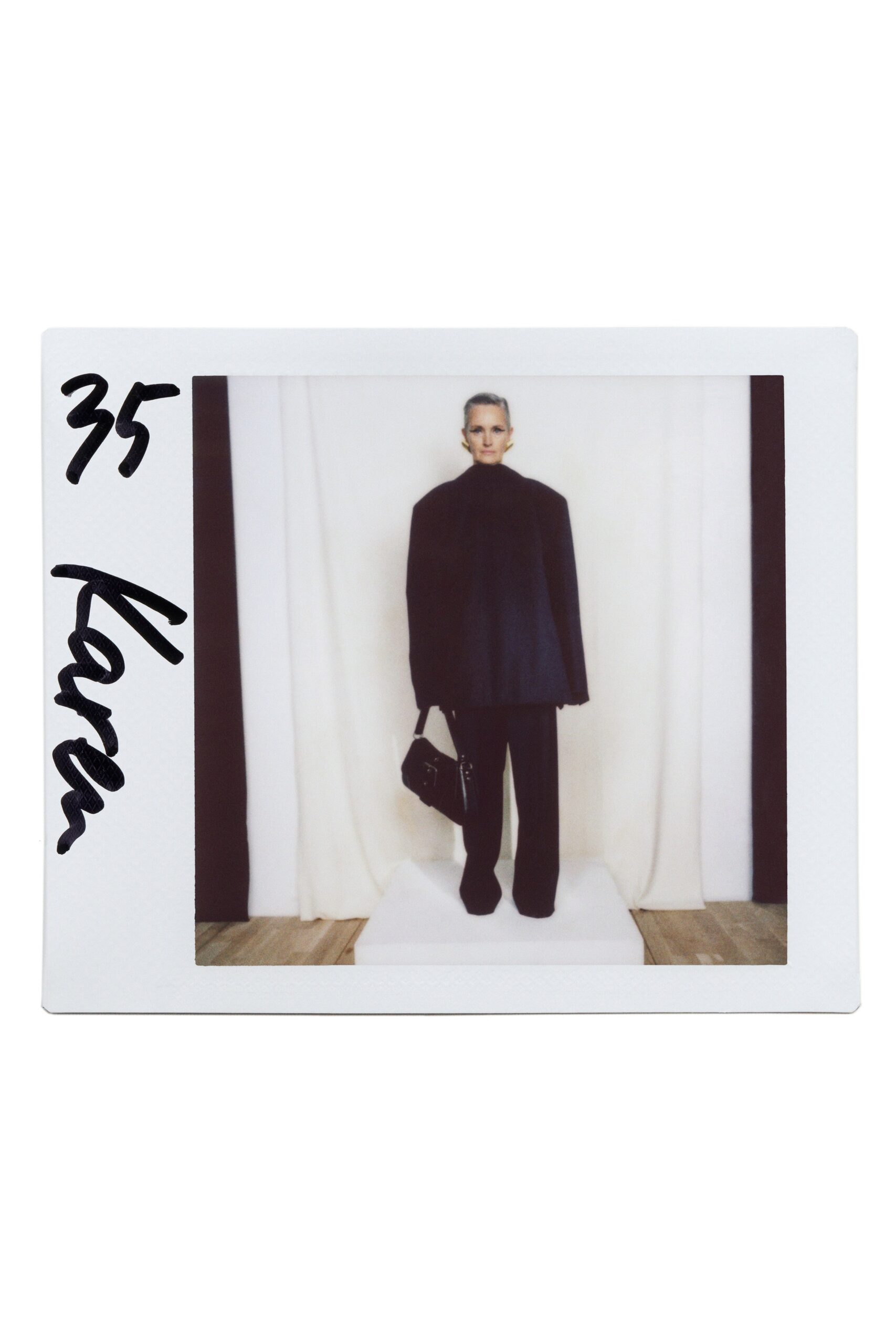 black wool long-sleeve high-neck oversized layered cape