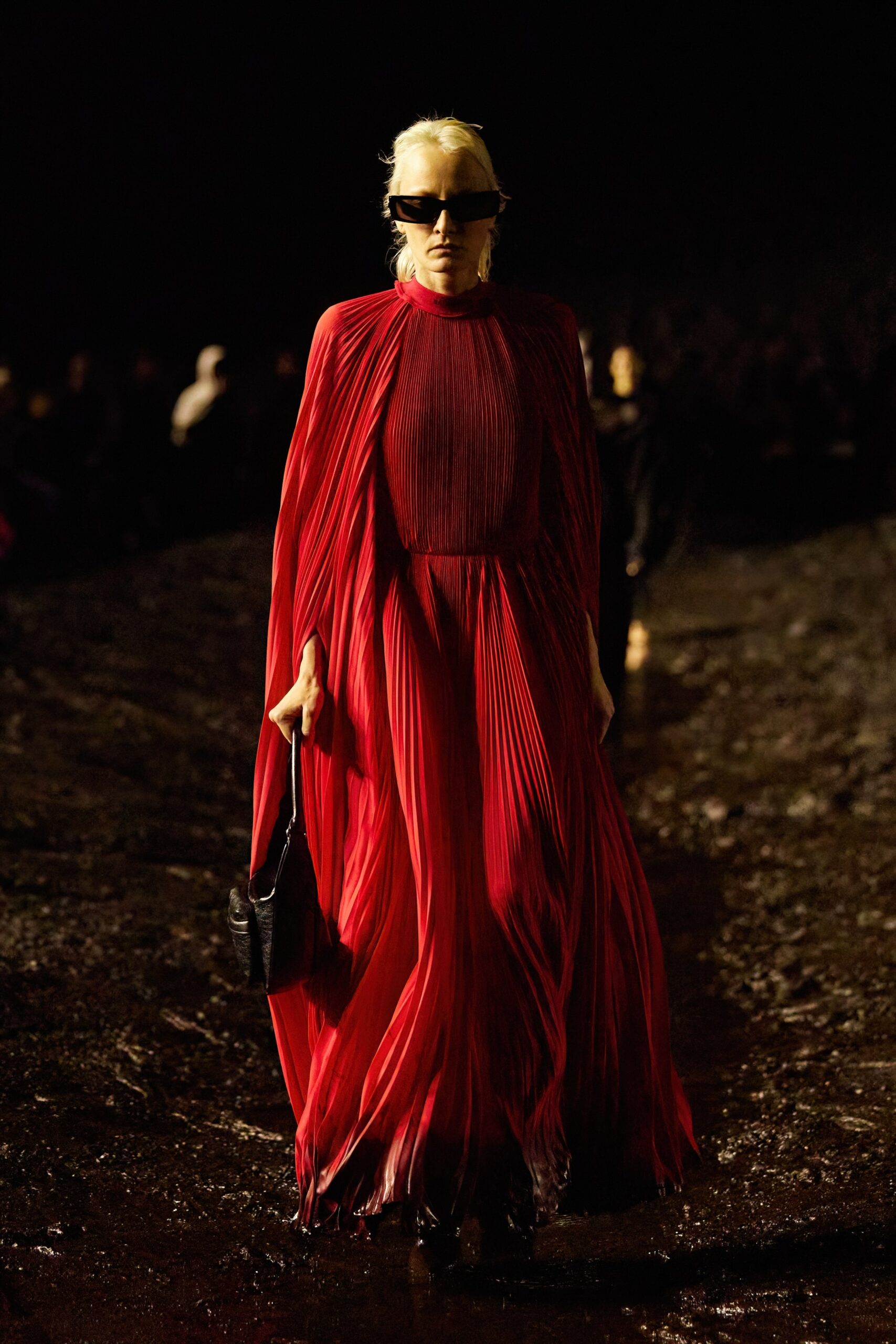 red pleated gown with sunglasses