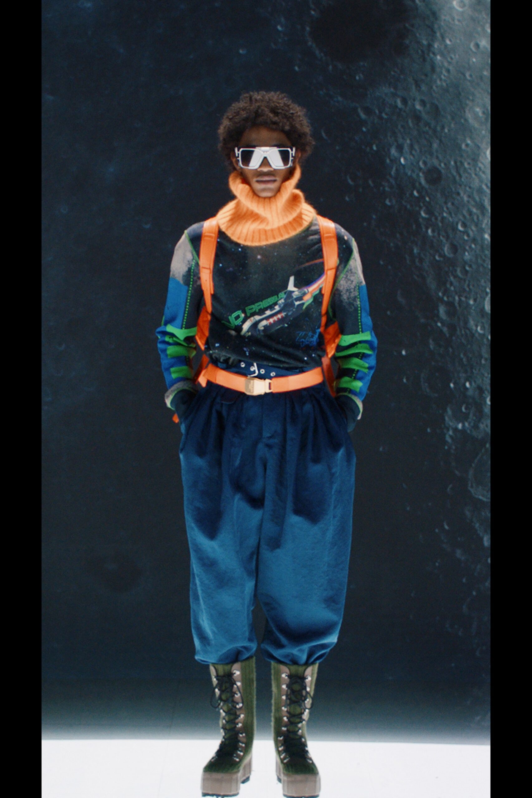 relaxed black orange sweater with blue pants