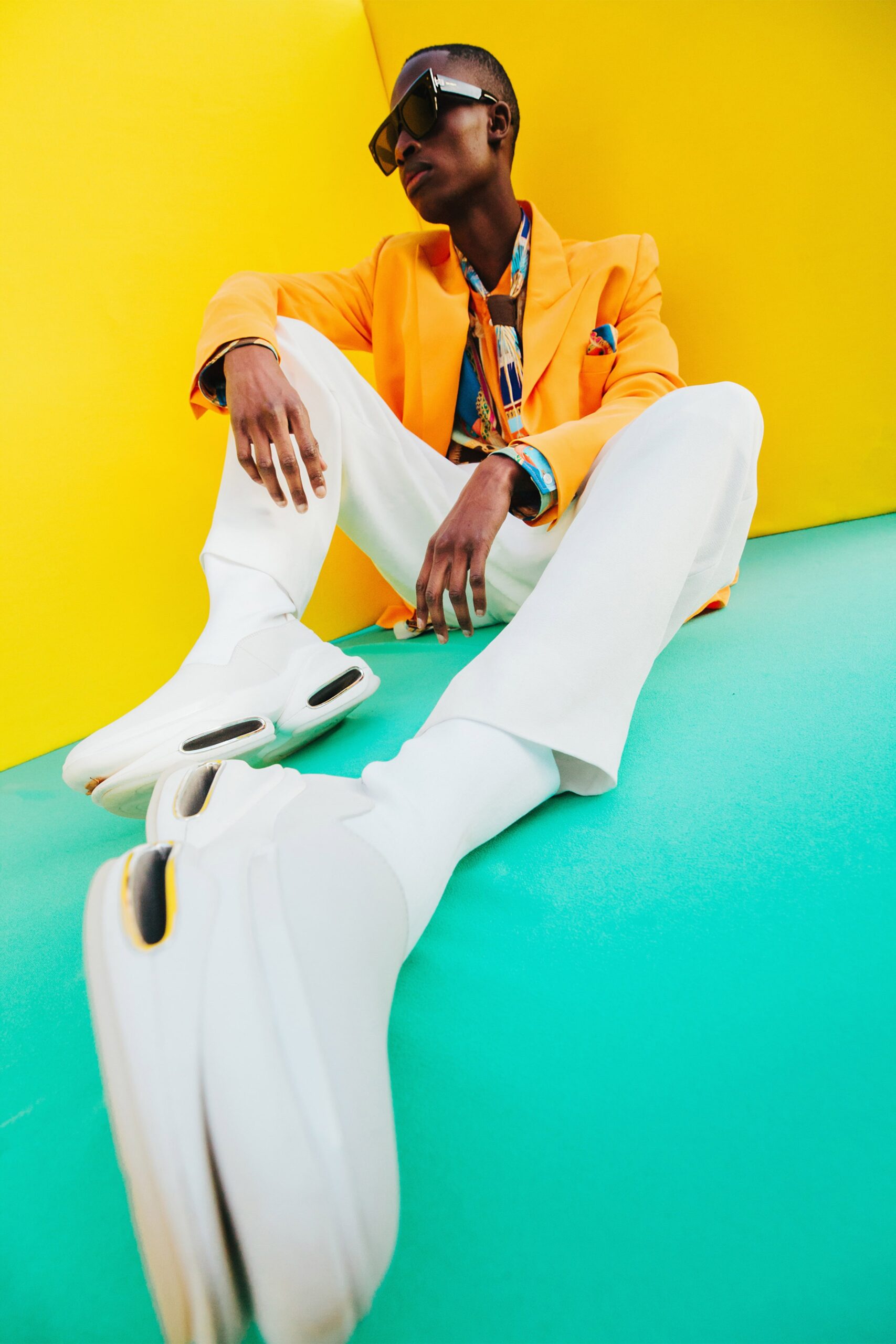 orange tailored blazer with white pants