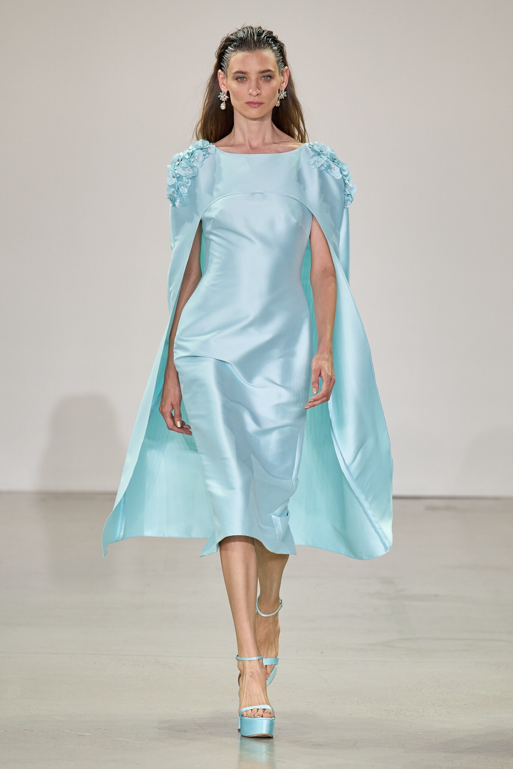 blue silk fitted dress with cape